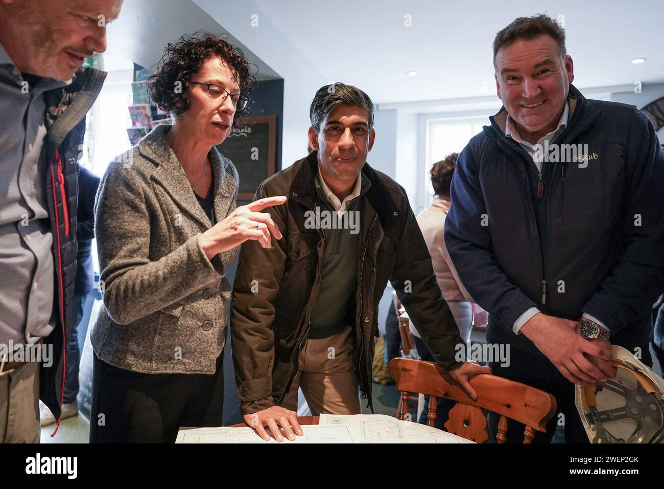 Prime Minister Rishi Sunak looks at building plans as he visits Corn