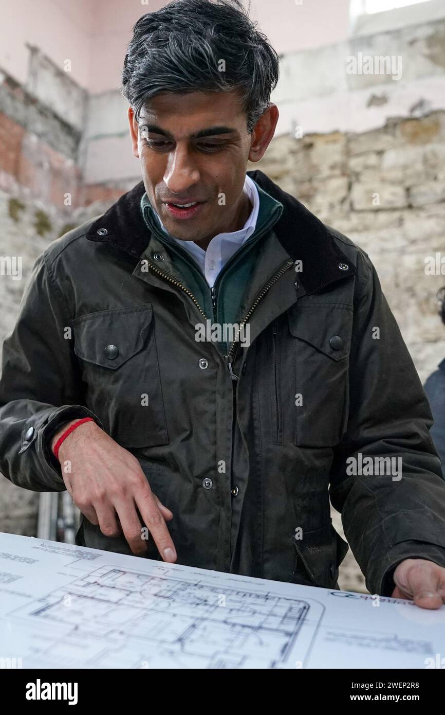Prime Minister Rishi Sunak looks at building plans as he visits Corn