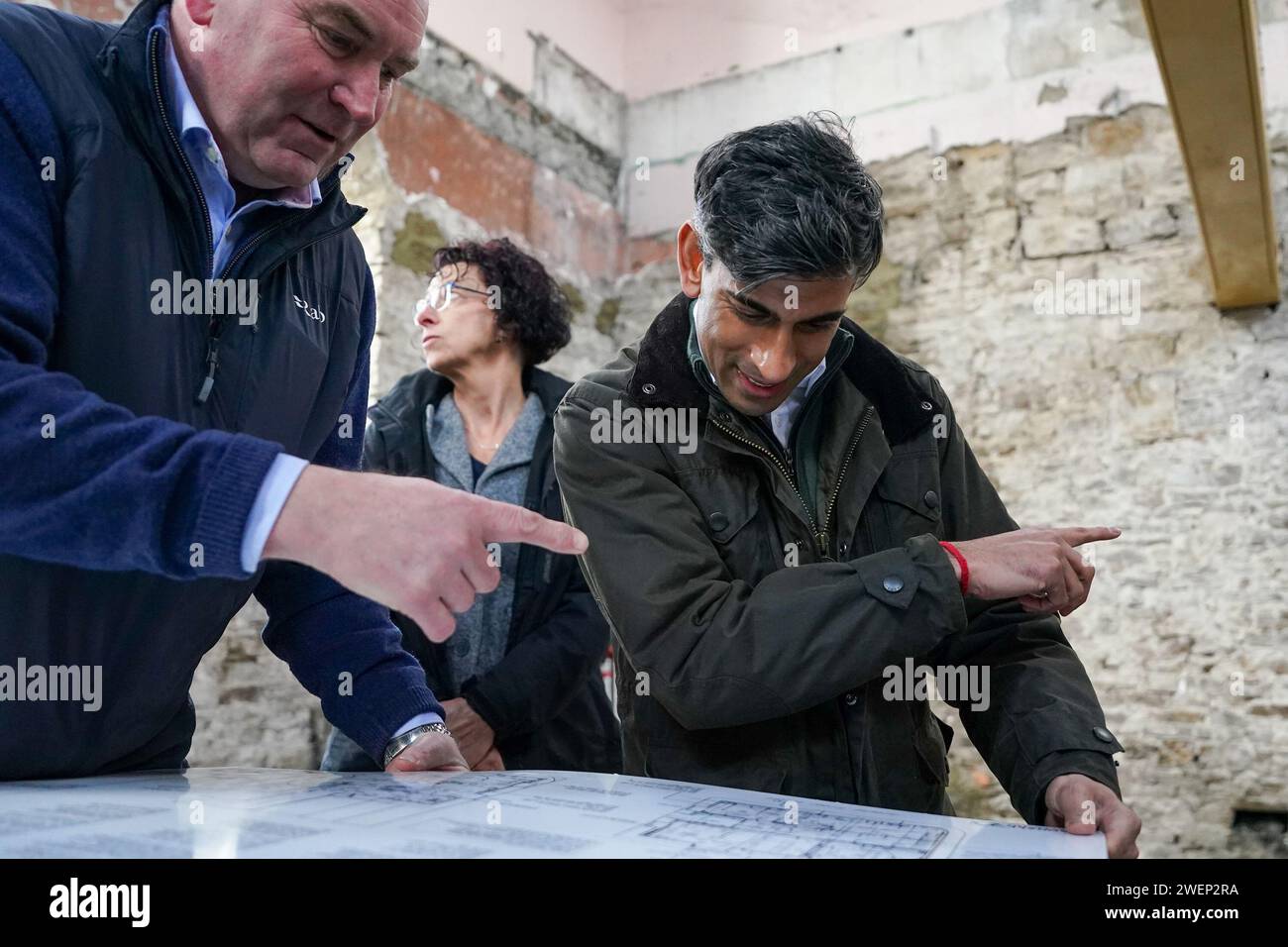 Prime Minister Rishi Sunak looks at building plans as he visits Corn