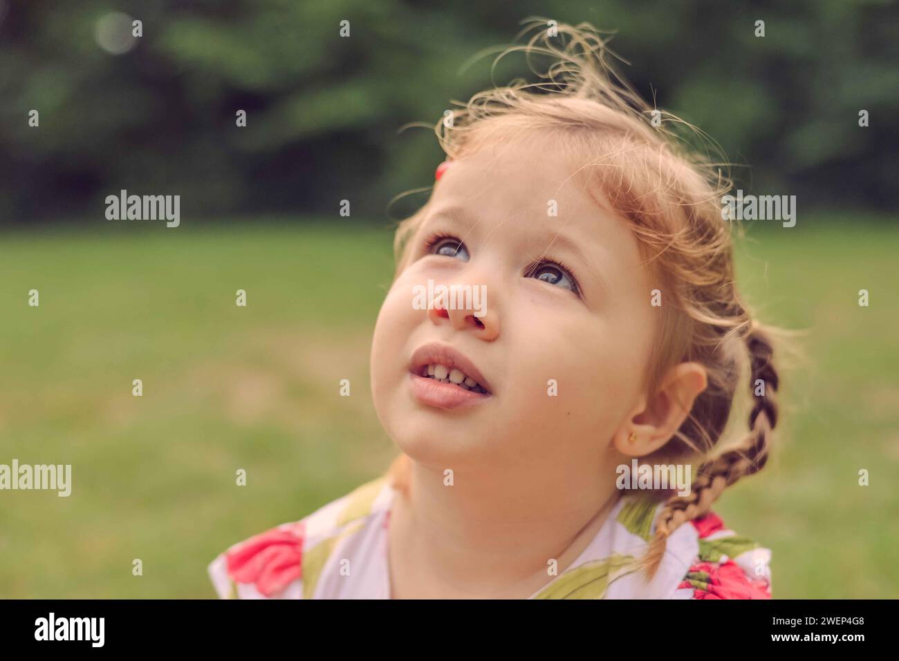 Little girl playing outside portrait Stock Photo