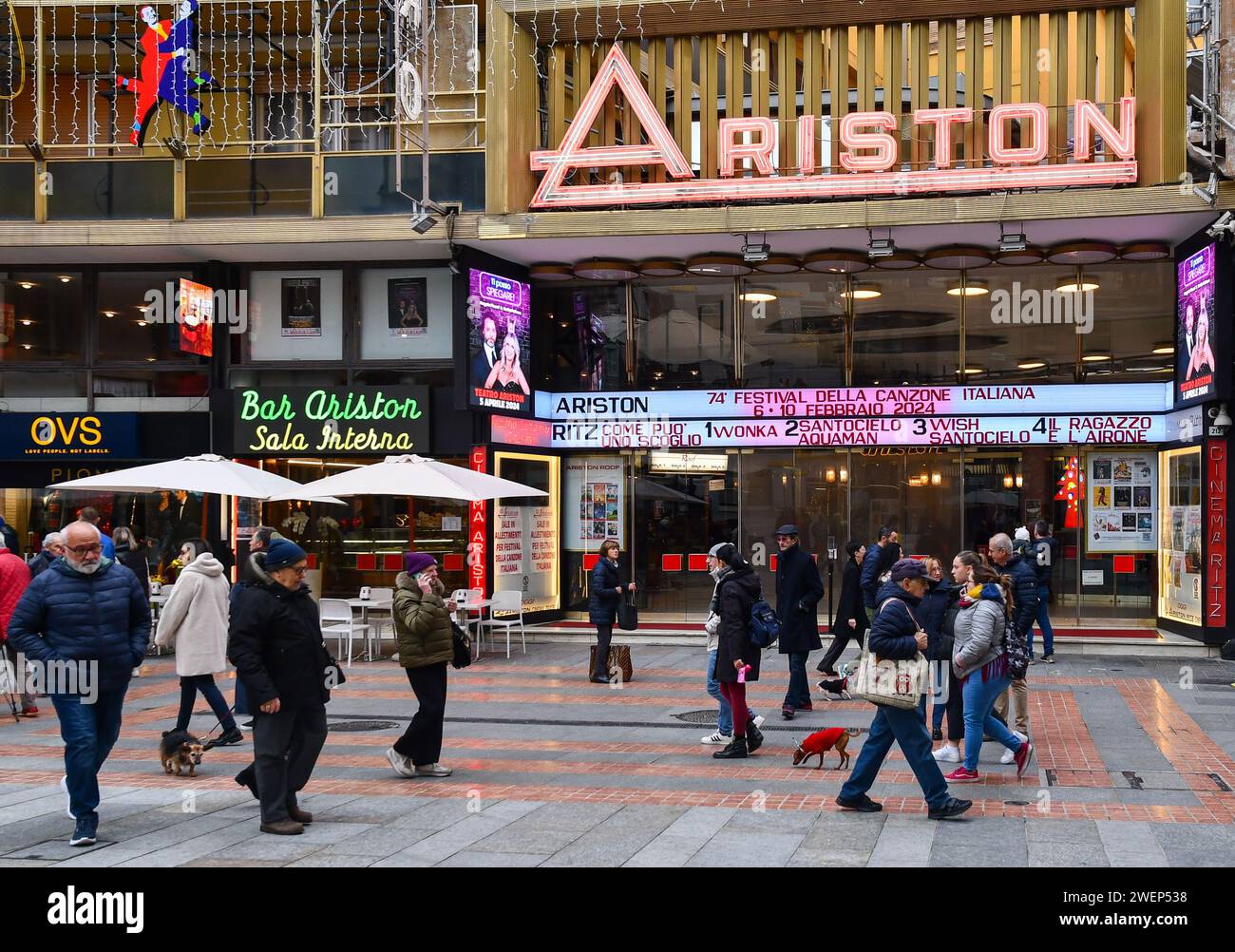 People walking in front of the Ariston Theatre, famous for annually ...