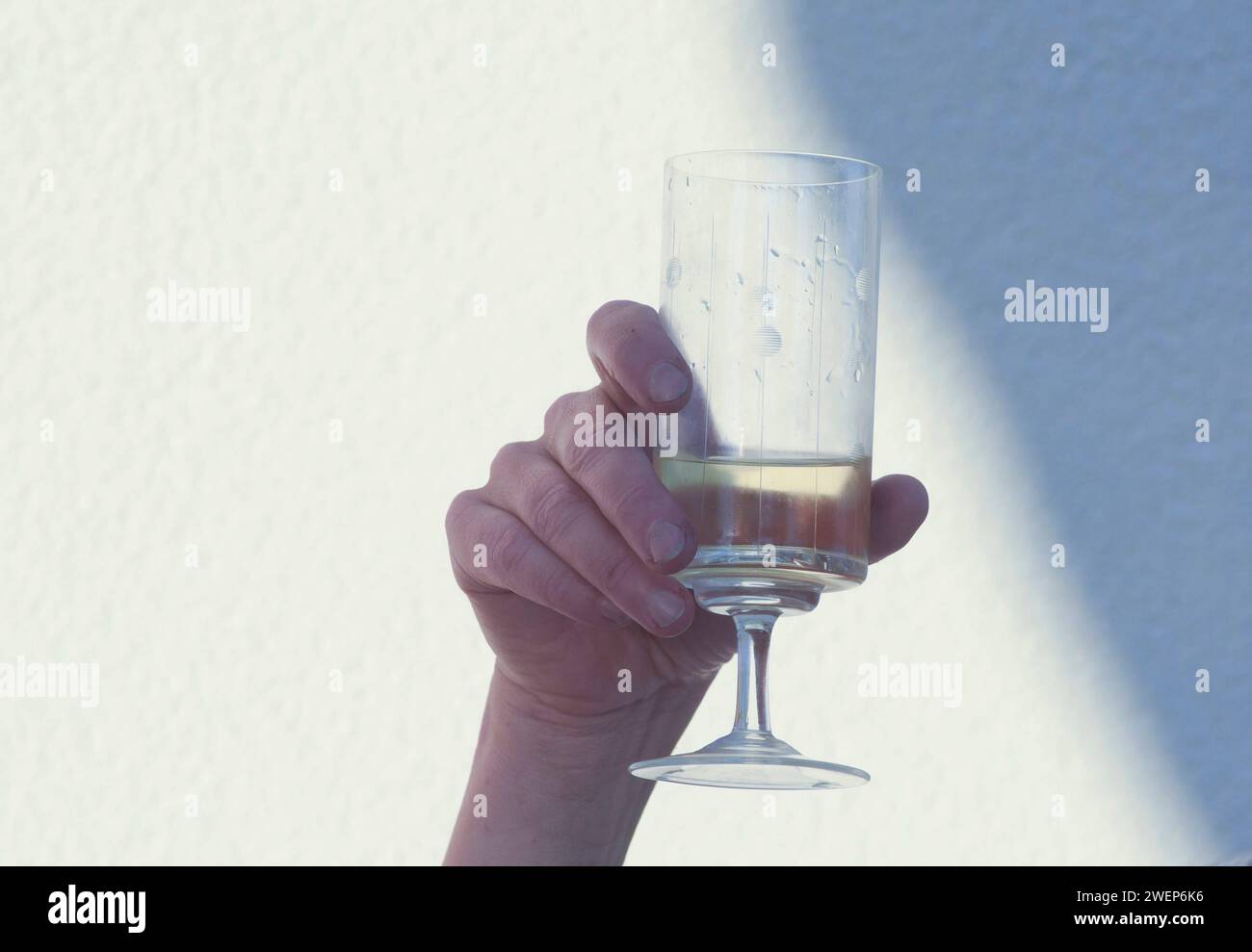 a wine glass for drinking, consumption of alcoholic beverages and enjoyment a wine glass for drinking Stock Photo