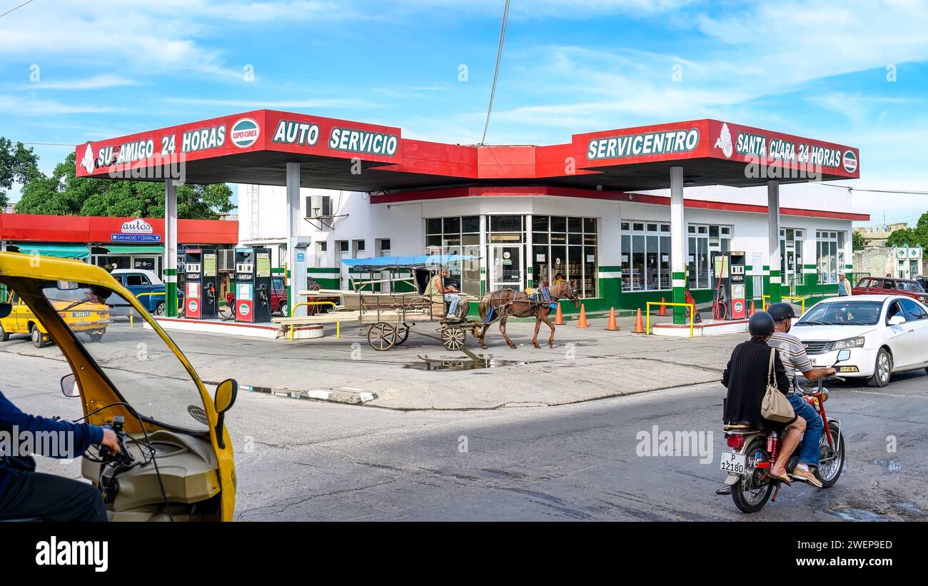 horse drawing cart in gas station, santa clara, cuba, 2024 Stock Photo