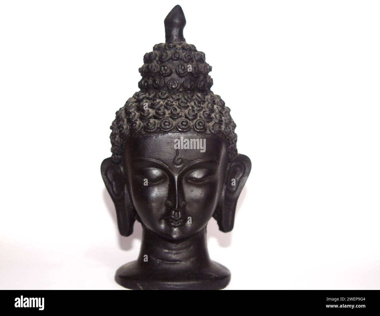 Small black sculpture on white background Stock Photo
