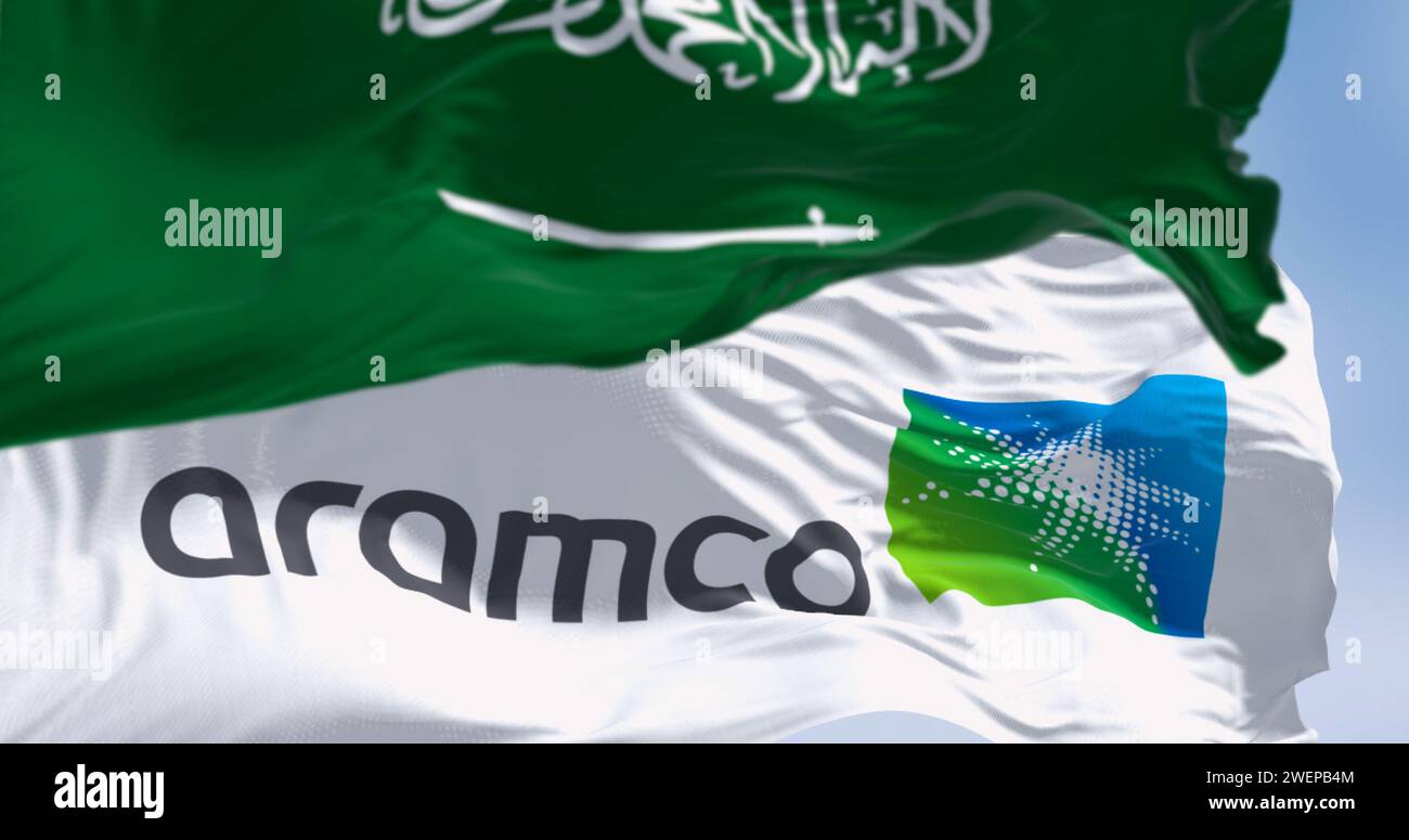 Dhahran, SA, Oct 20 2023: Flags of Dhahran, SA, jan 10 2024: Aramco and Saudi Arabia waving on a clear day. Saudi national hydrocarbon company. Illust Stock Photo