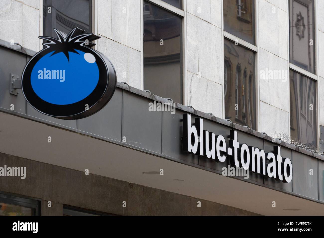 Picture of a sign with the logo of Blue Tomato on their local shop for Dusseldorf, Germany. Blue tomato is an austrian retailer specialized in ski equ Stock Photo