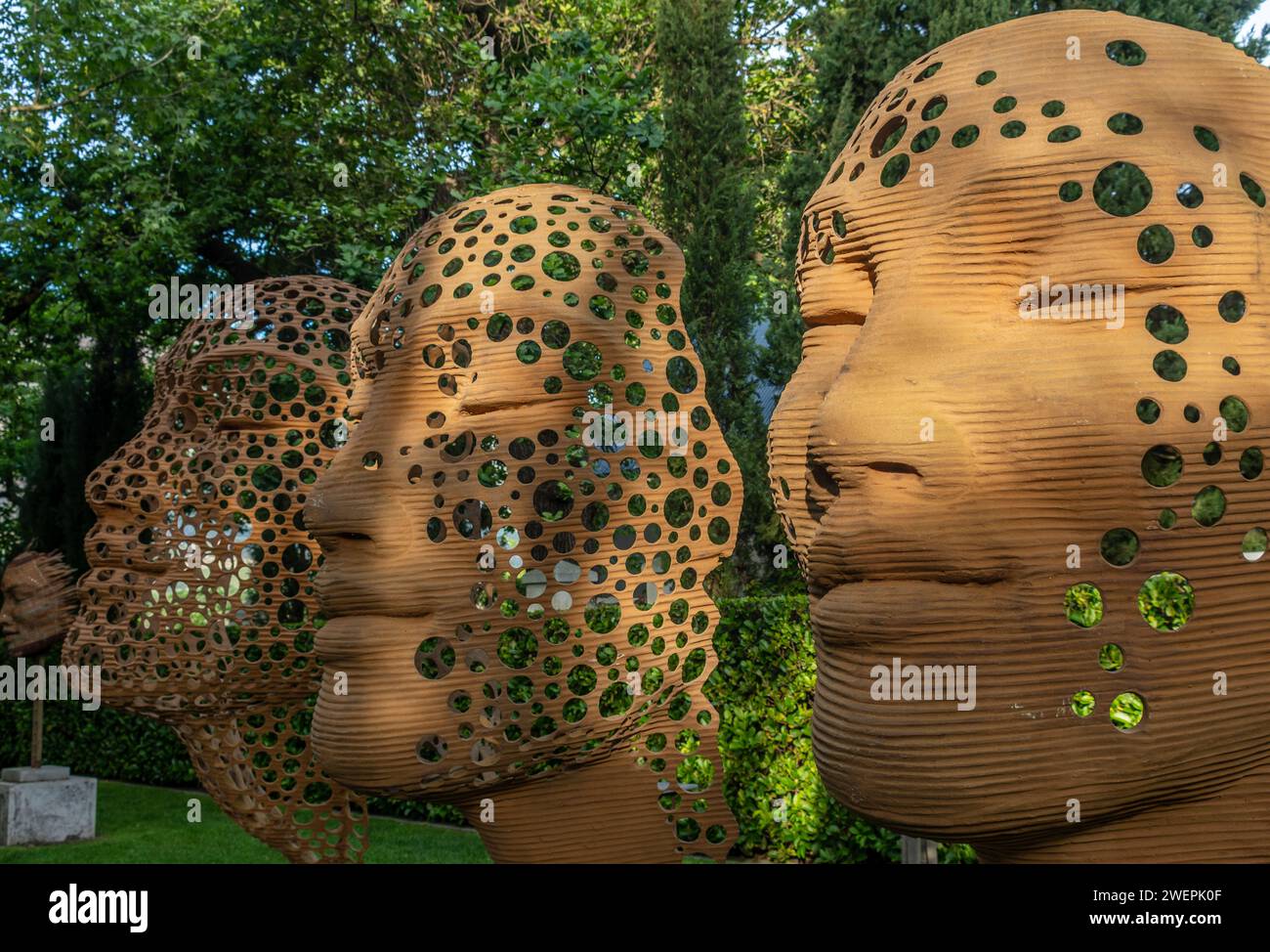 Some outdoor sculptures amidst lush greenery and trees Stock Photo