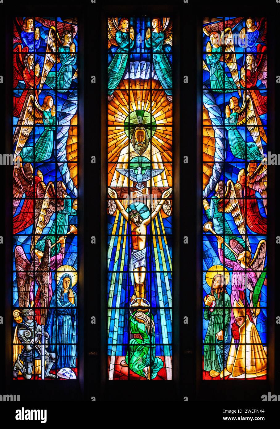 The Holy Trinity. A stained-glass window in Igreja de Nossa Senhora de Fátima, Lisbon. Stock Photo