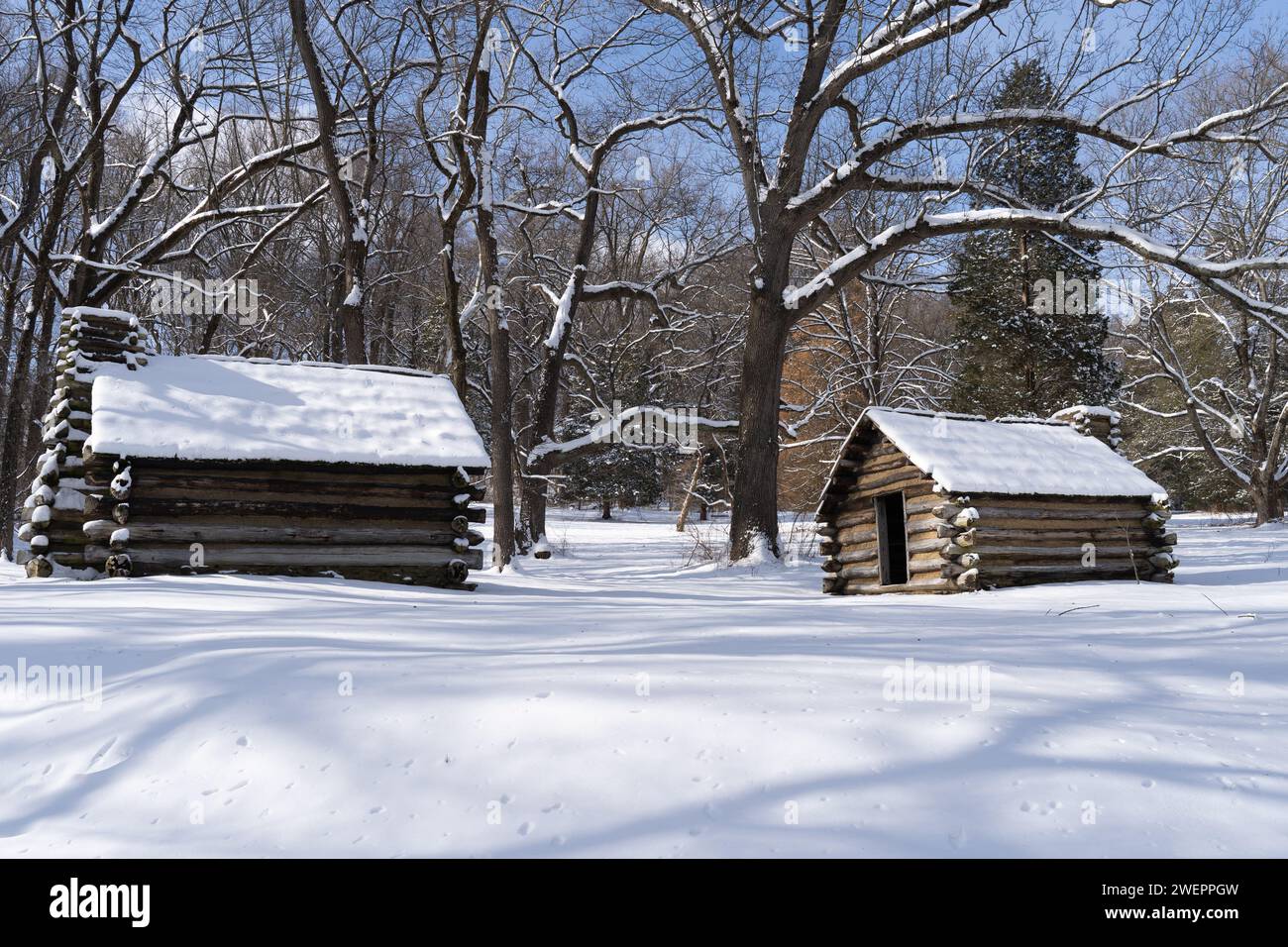 Snow covered log cabins at Valley Forge National Historic Park Stock Photo