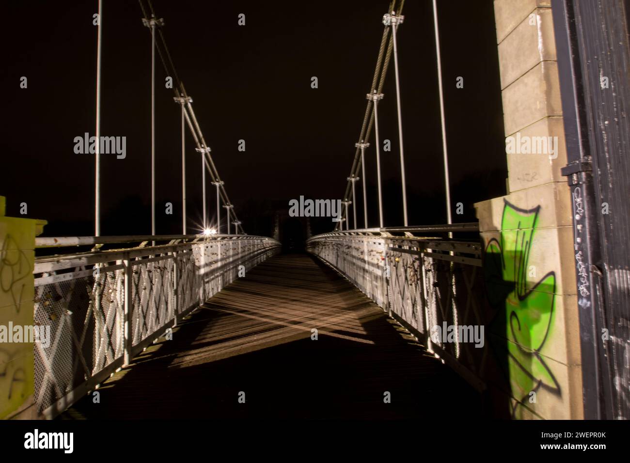 The Wilford Suspension Bridge at night in Nottingham, UK Stock Photo