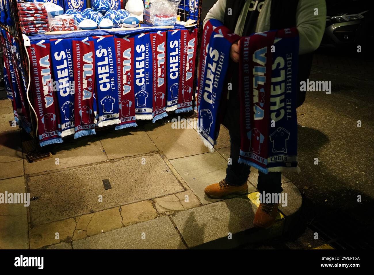 A scarf seller outside the ground ahead of the Emirates FA Cup fourth round match at Stamford Bridge, London. Picture date: Friday January 26, 2024. Stock Photo