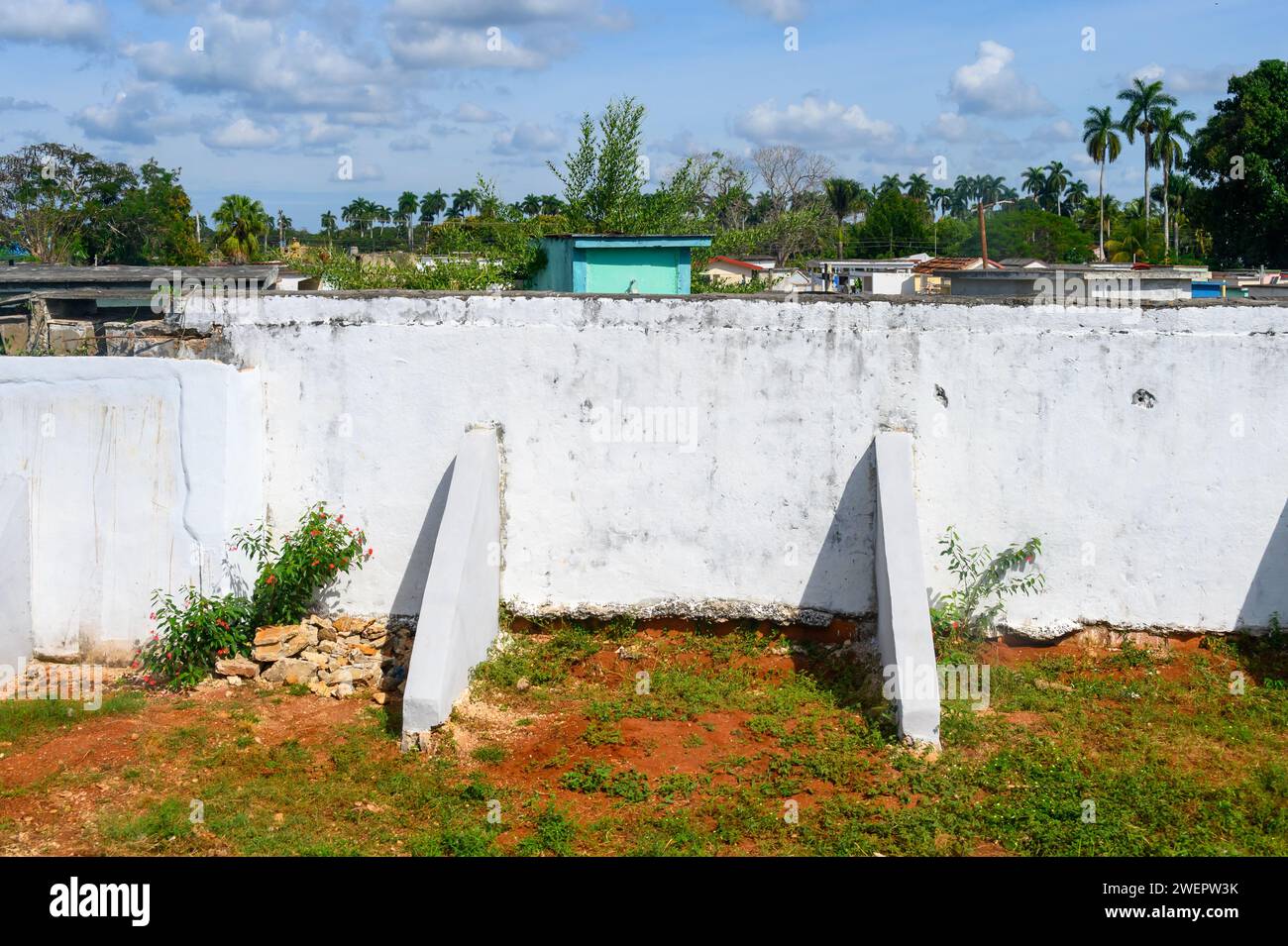 Pillars supporting a collapsing fence in a cemetery, rural Matanzas Stock Photo