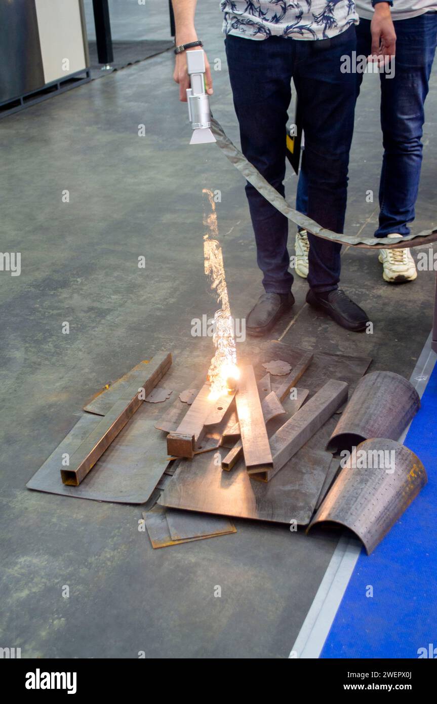 Laser cleaning of metal. The laser beam cleans the metal surface from