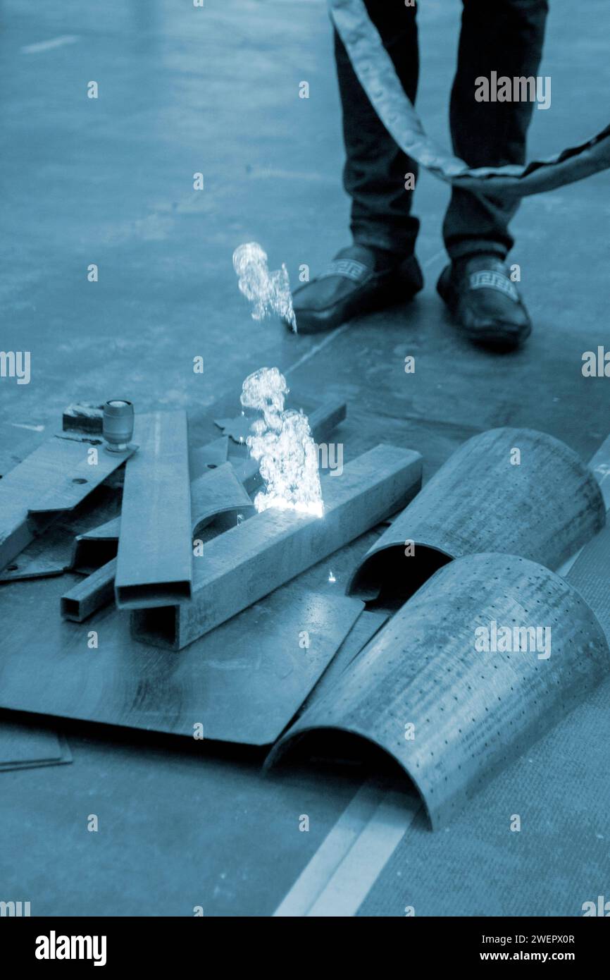 Laser cleaning of metal. The laser beam cleans the metal surface from