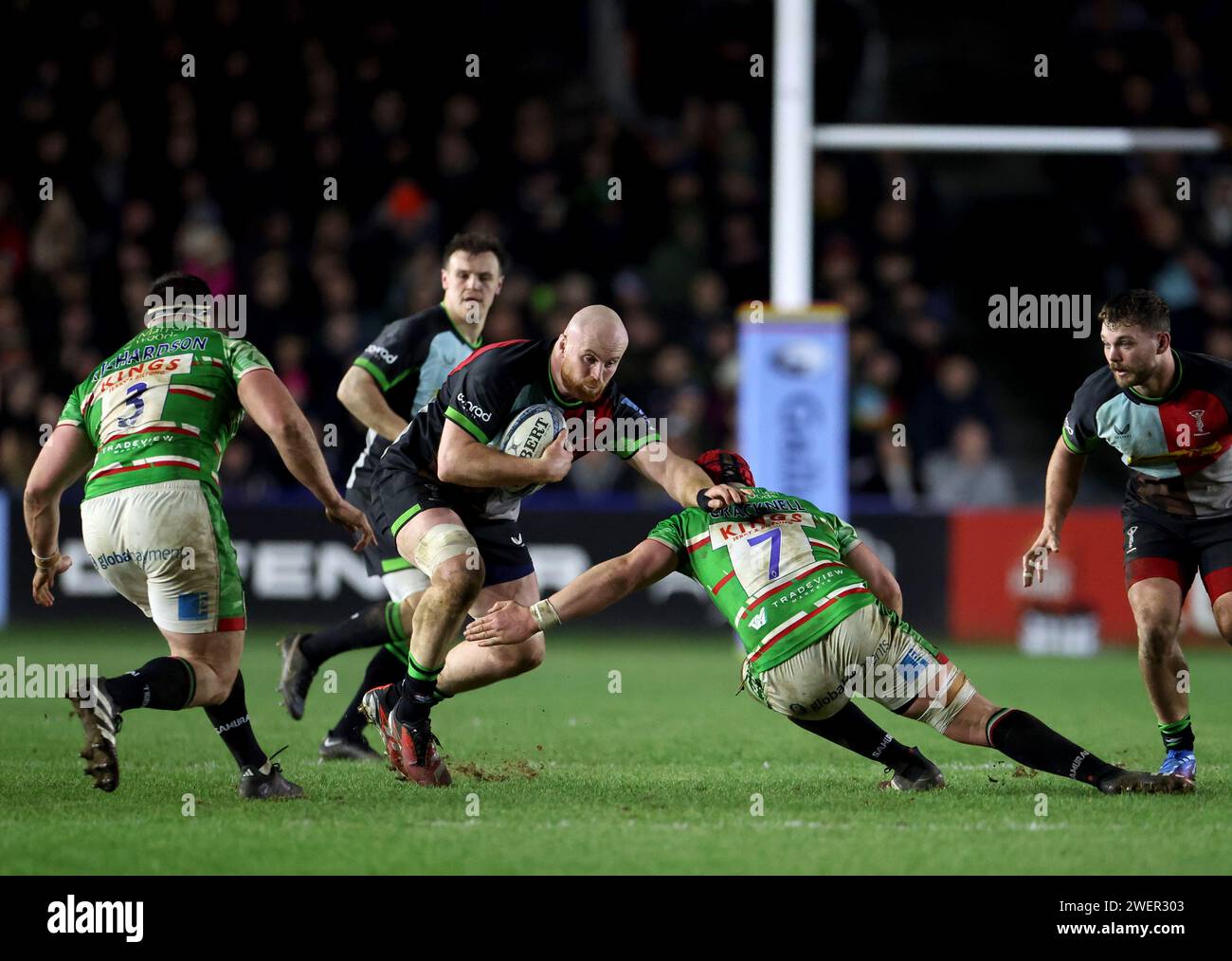 Harlequins' James Chisholm is tackled by Leicester Tigers' Olly Cracknell (right) during the Gallagher Premiership match at the Twickenham Stoop, London. Picture date: Friday January 26, 2024. Stock Photo