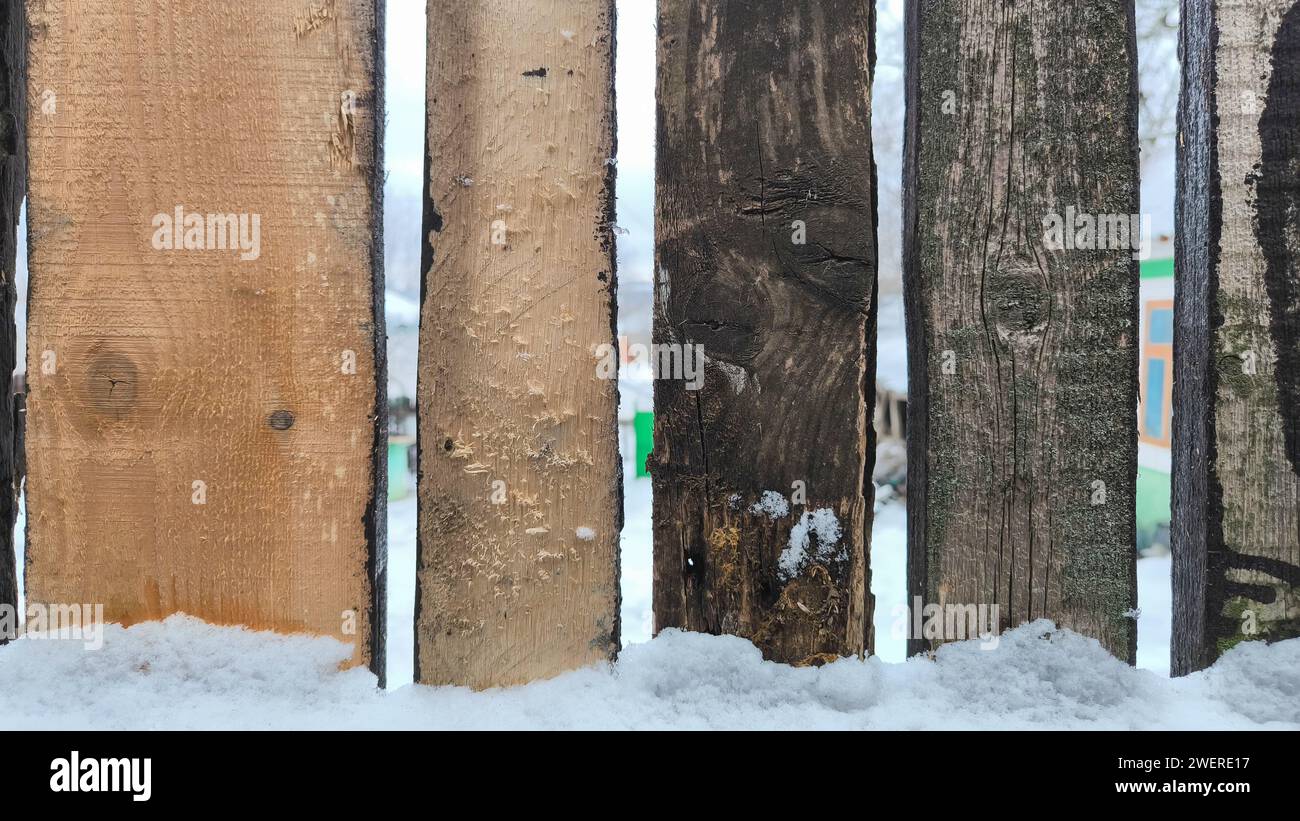 Wooden fence in the snow. Winter background. Wood texture Stock Photo ...