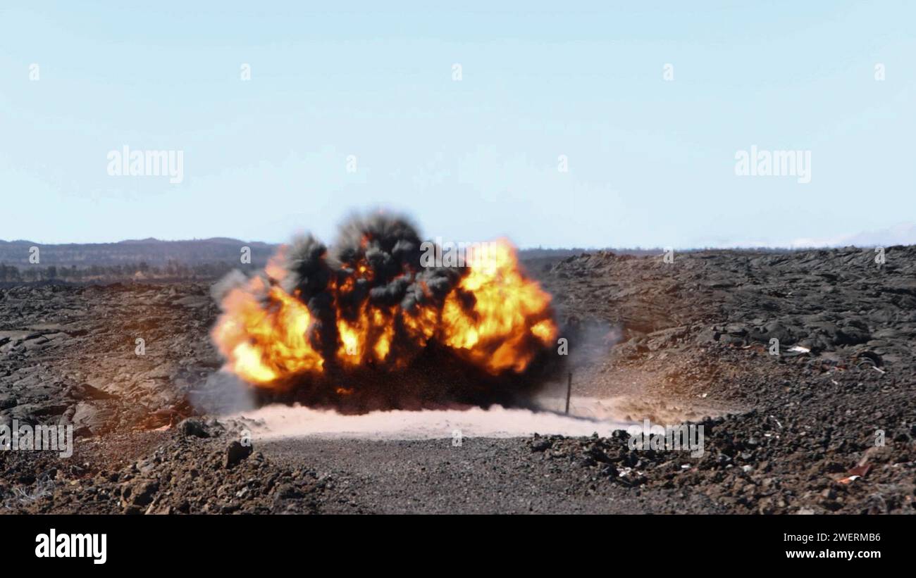 A Bangalore torpedo detonates at a demolition range during exercise Bougainville III at Pohakuloa Training Area, Jan. 24, 2024. Bougainville III is a 3d LCT live-fire exercise focused on decentralized operations to prepare the battalion to command and control forces from dispersed locations. (U.S. Marine Corps photo by Lance Cpl. Clayton Baker) Stock Photo