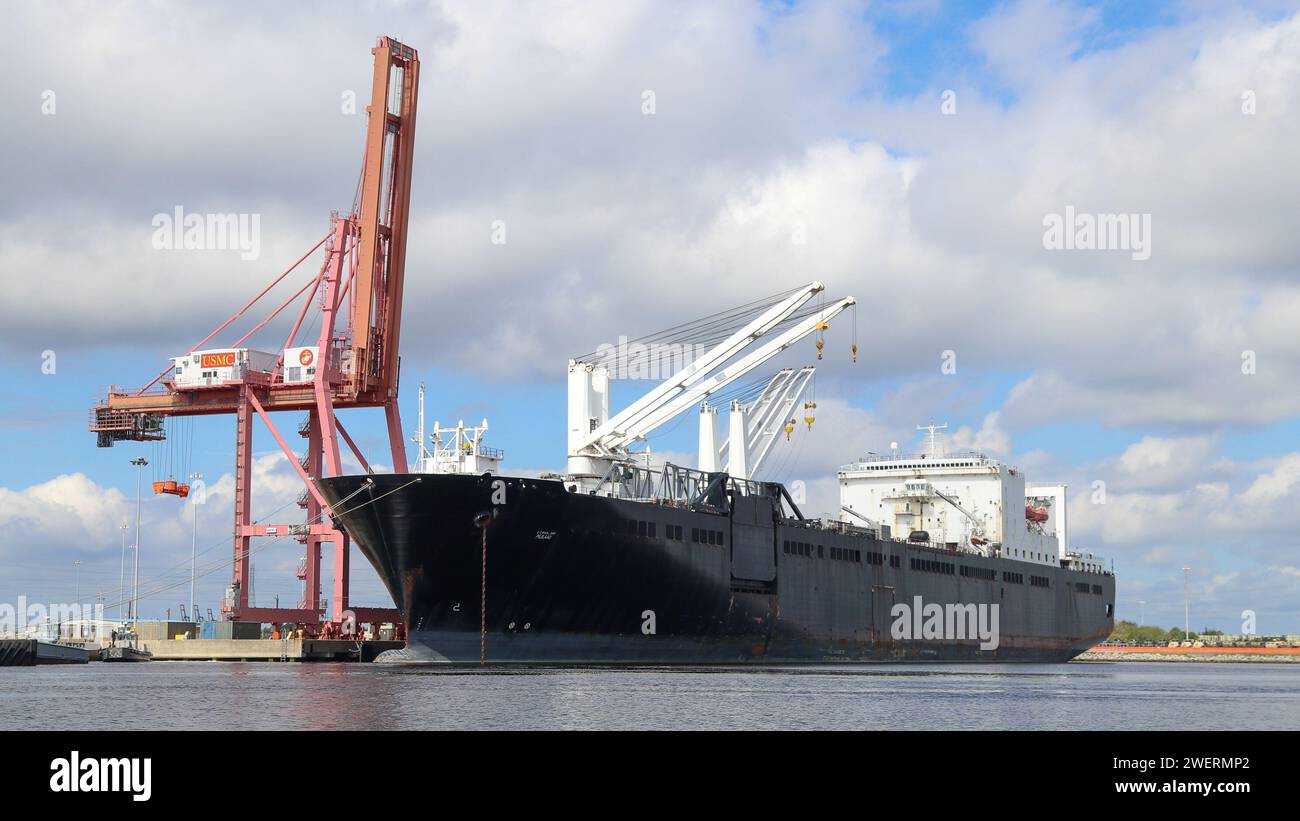 U.S. Marines load USNS PILILAAU with readyforissue equipment and