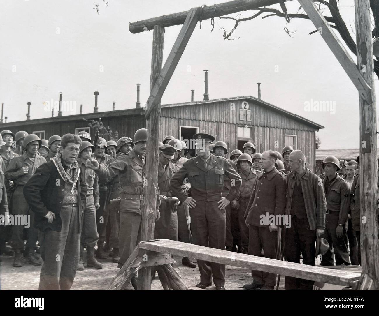 OHRDRUF CONCENTRATION CAMP, Thuringia, Germany. General Dwight D. Eisenhower  visits the camp shortly after its liberation on 4 April 1945 by US Fourth Armoured Division and the 890th Infantry Division.  Here a camp survivor talks to Eisenhower next to the camp gallows. Stock Photo