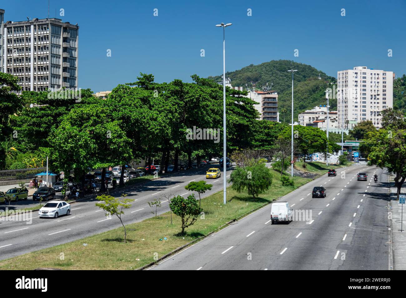 West view of Rei Pele avenue saw from Maracana train station footbridge, nearby Rio de Janeiro State University (UERJ) under summer morning blue sky. Stock Photo