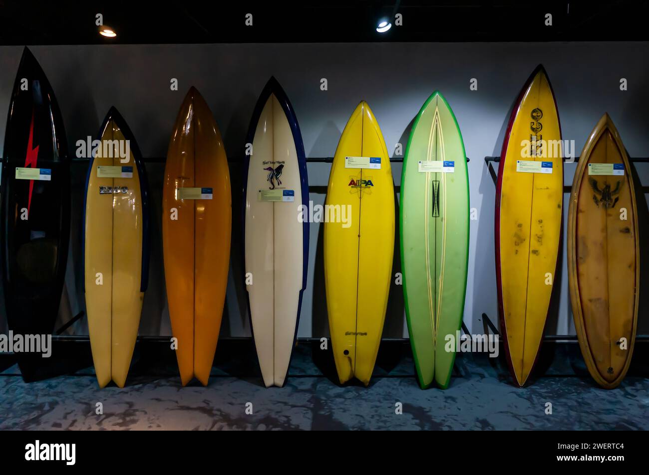 A collection of colorful surfboards at a wall, part of Rico Surf museum exhibition displayed inside AquaRio public marine aquarium in Gamboa district. Stock Photo
