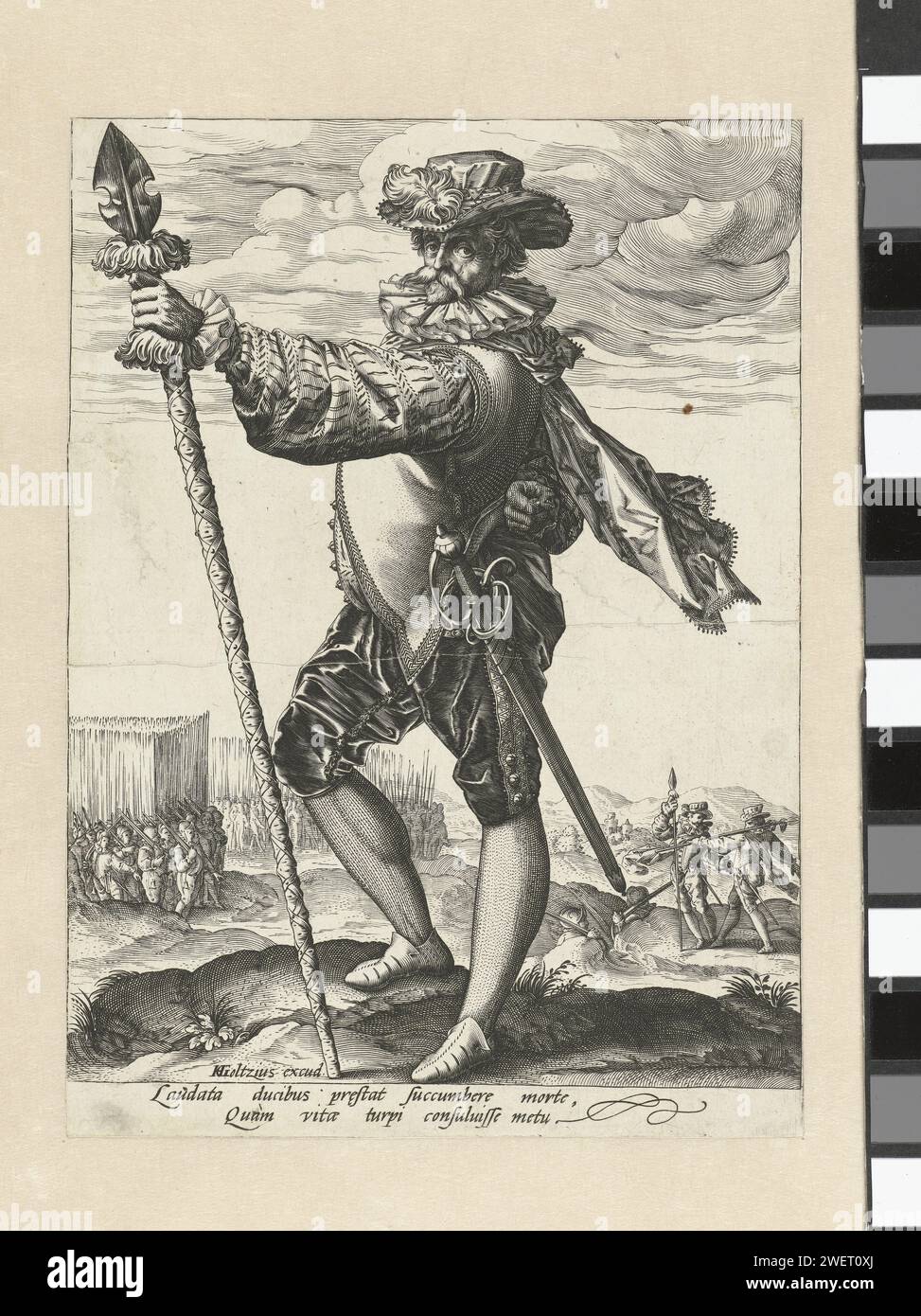 Officer in the army, 1585 - 1589 print A man with a stab weapon (partizan) in the right hand, back. In the background infantry groups. Under the performance two lines of text in Latin. This print is part of a series of three military officials.  paper engraving officer Stock Photo