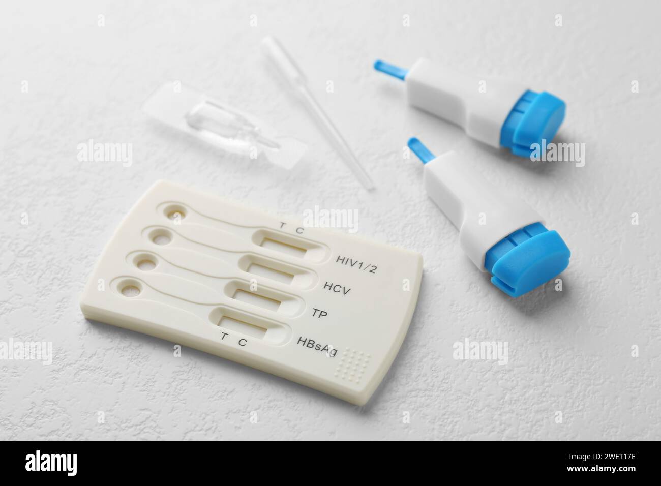 Disposable multiinfection express test kit on white table Stock Photo