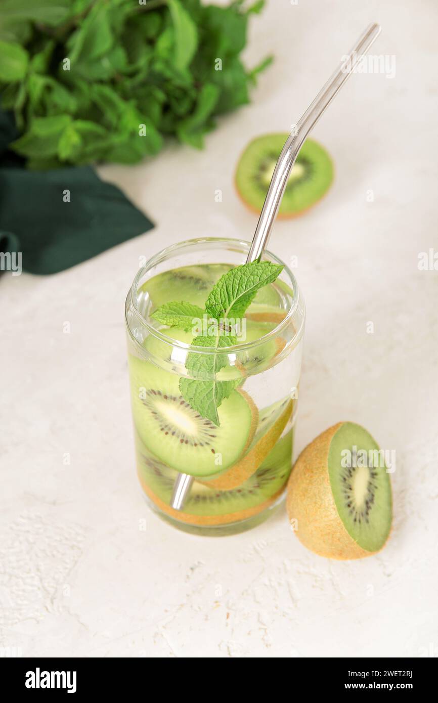 Glass of infused water with kiwi and mint on white background Stock