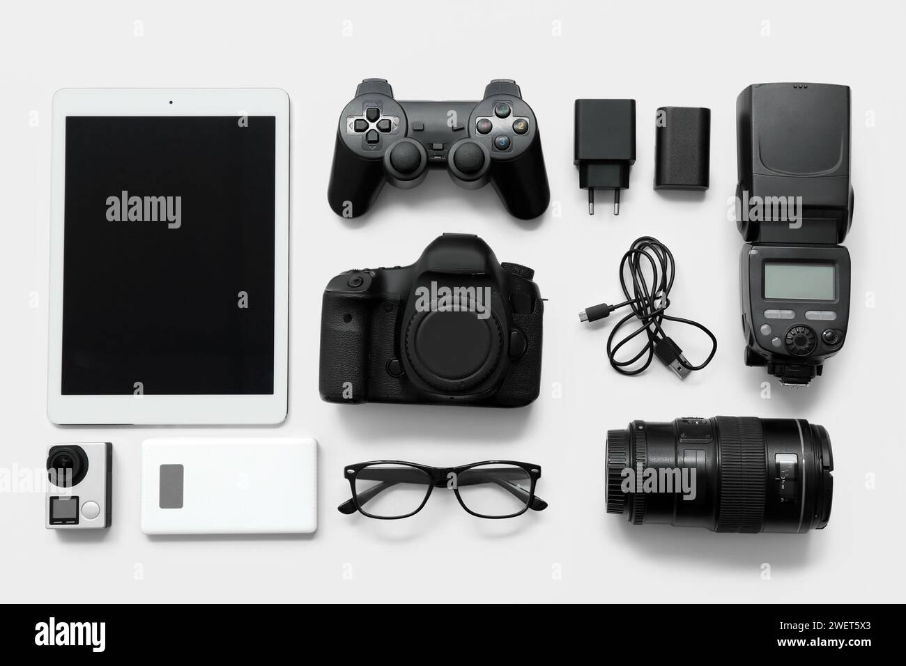 Composition with different modern gadgets on light background Stock Photo