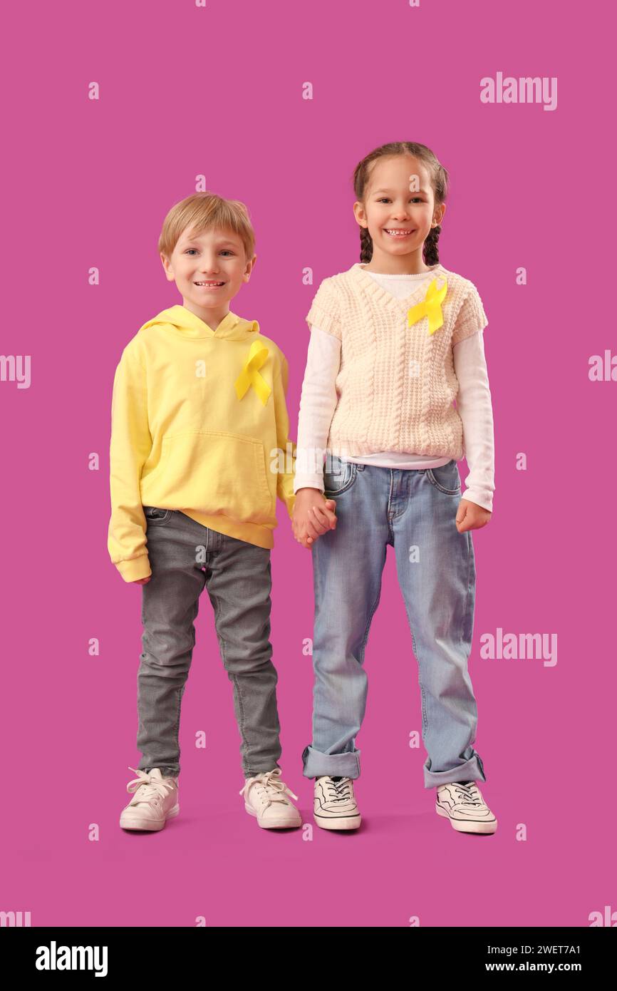 Cute little children with yellow ribbons on purple background ...