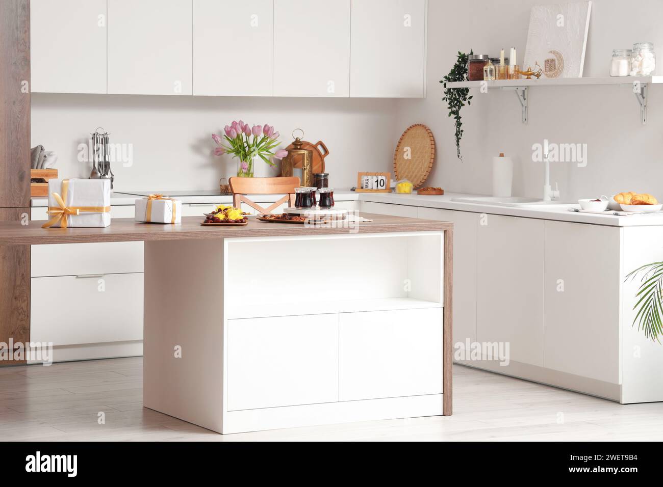 Interior of kitchen with counters and traditional food for Ramadan ...