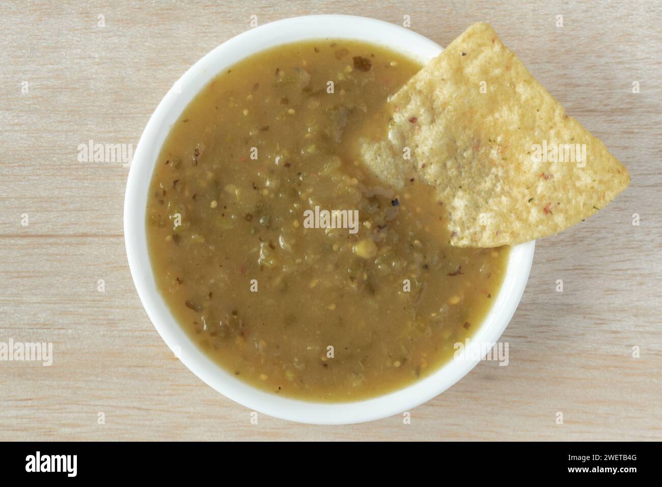 Green Salsa with Tortilla Chip Stock Photo