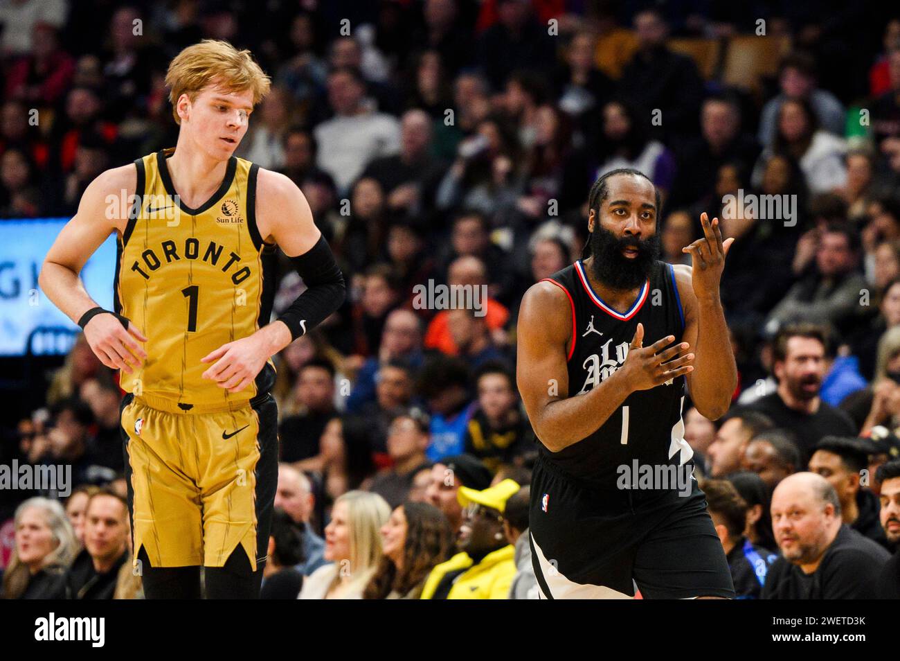 Toronto, Canada. 26th Jan, 2024. Los Angeles Clippers guard James Harden  (1) celebrates after a basket while Toronto Raptors guard Gradey Dick (1)  looks on during second half NBA basketball action, in