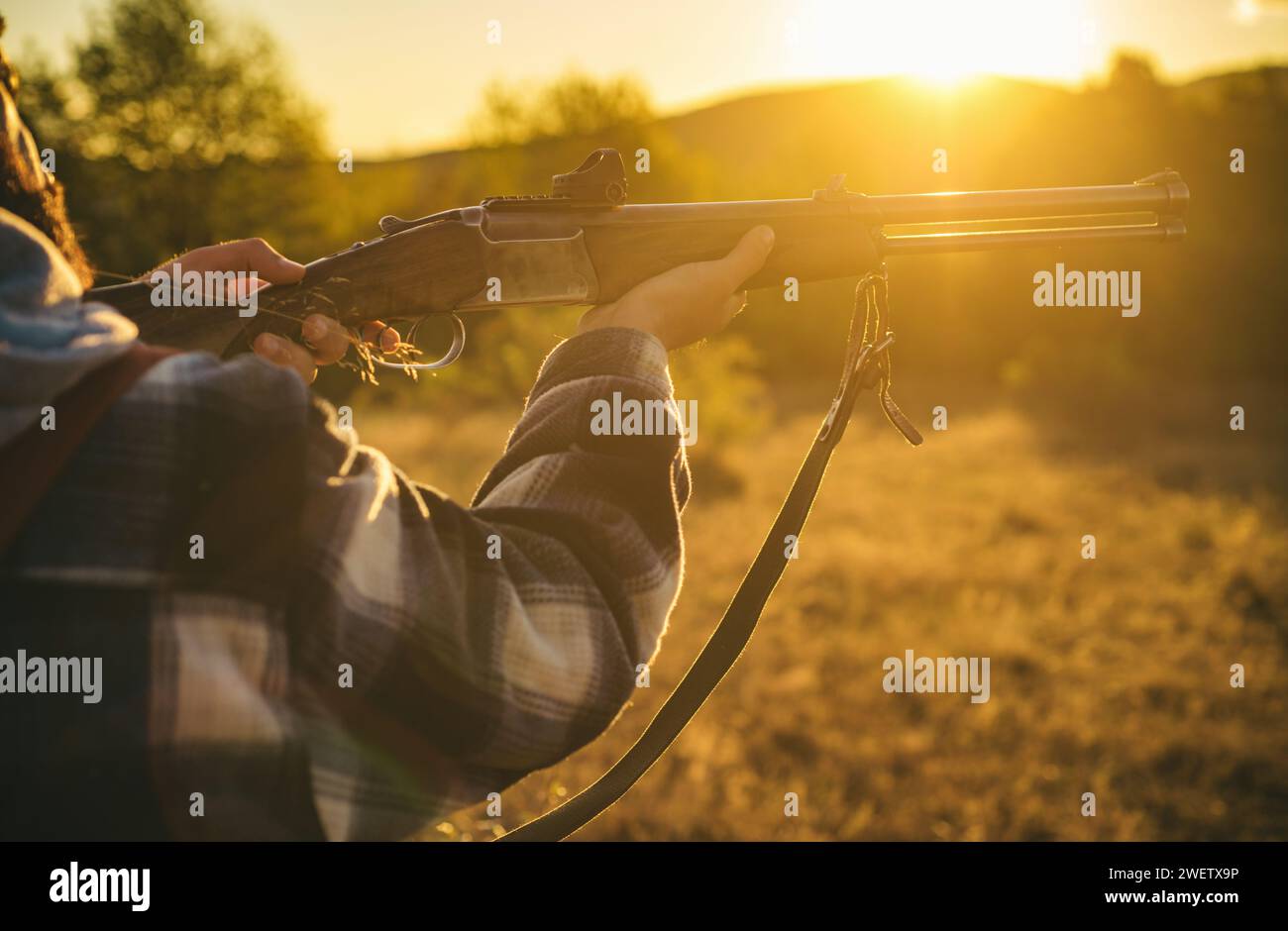 P Hunter Hunter with shotgun gun on hunt. Illegal Hunting Poacher in the Forest ...