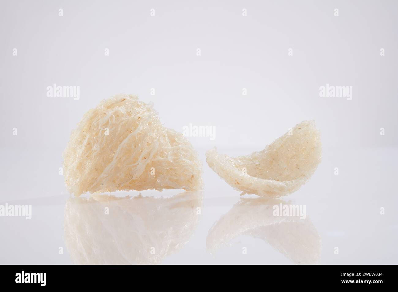 Scene for advertising product from natural origin with raw edible bird’s nest isolated on white