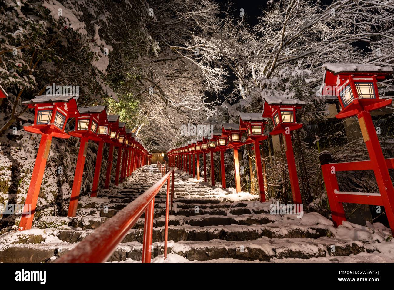 Kifune shrine stone stairs and traditional light pole in snowy winter night. Snow in Kyoto, Japan. Stock Photo