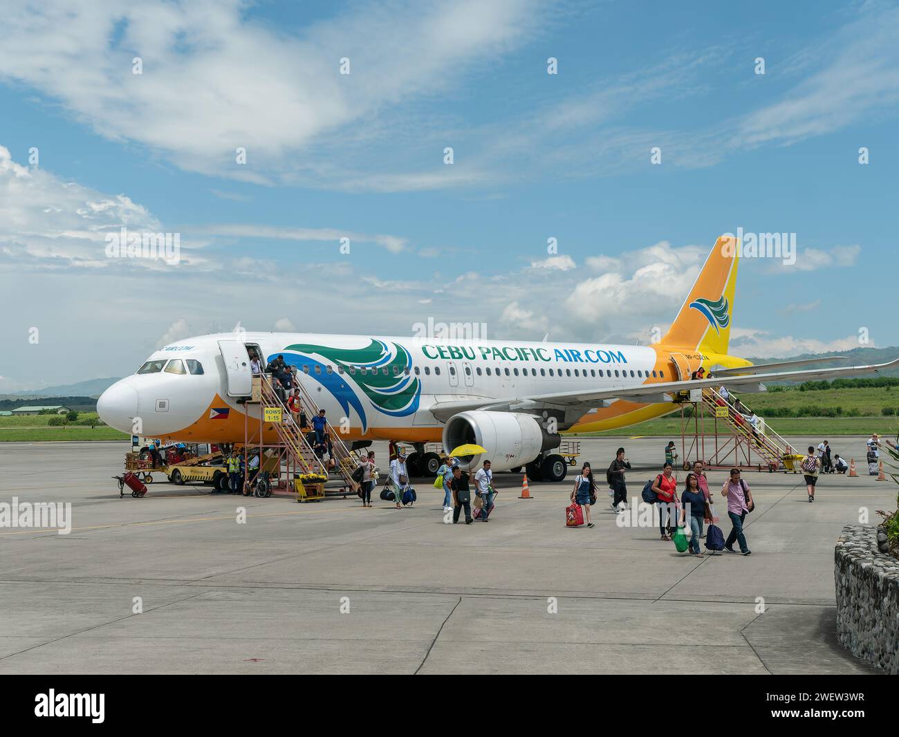 General Santos City, Philippines - July 8, 2017: Passengers disembarking from a Cebu Pacific Airbus A320 NEO at General Santos International Airport o Stock Photo