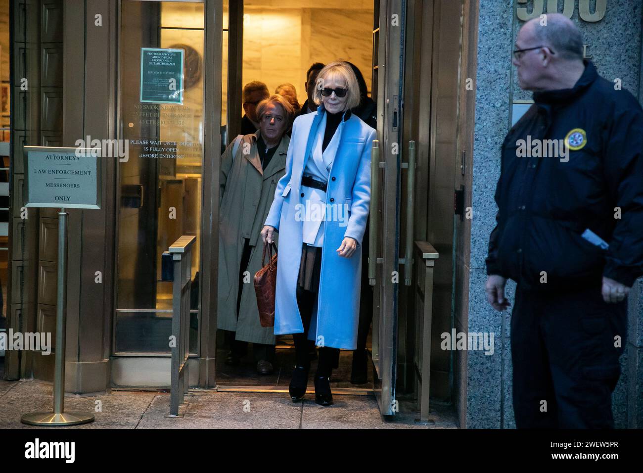 (240127) -- BEIJING, Jan. 27, 2024 (Xinhua) -- E. Jean Carroll leaves a federal court in Manhattan during her civil defamation trial against former U.S. President Donald Trump in New York, the United States, on Jan. 25, 2024. Trump on Thursday testified briefly in E. Jean Carroll defamation trial at the U.S. District Court for the Southern District of New York, local media reported. Carroll, an American writer and former magazine columnist, accused Trump of raping her in the mid-1990s at a department store dressing room in Manhattan, New York City, and of later defaming her by denying her cl Stock Photo