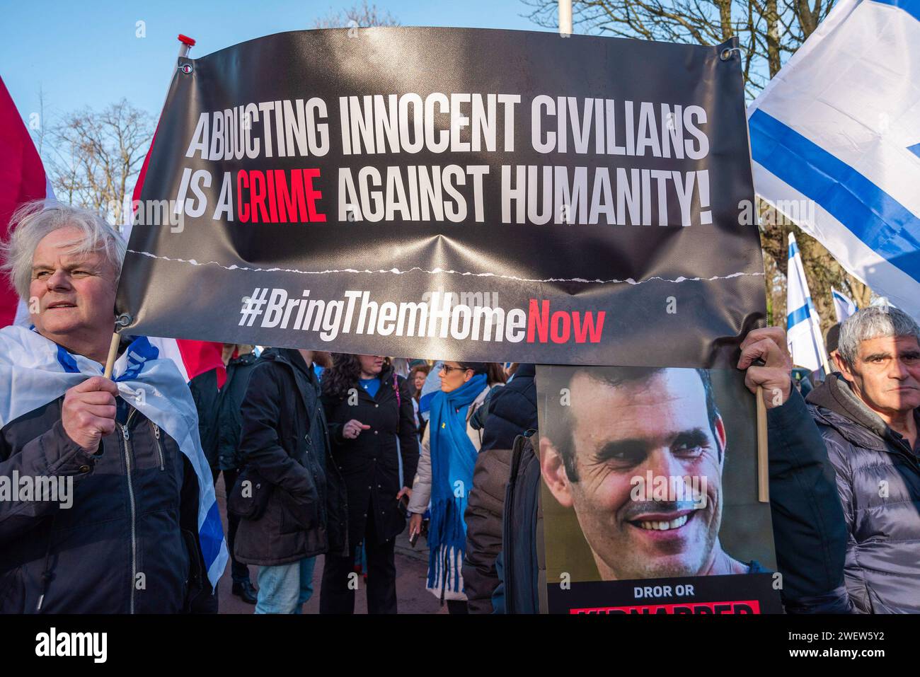 The Hague, South Holland, Netherlands. 26th Feb, 2014. Two Israeli men supporters with a large banner, express their opinion, during today's International Court of Justice's (ICJ) First ruling on IsraelÃ-s Gaza war. The ICJ in The Hague ordered Israel on Friday to refrain from any acts of genocide against Palestinians in Gaza during its conflict with Hamas and to preserve evidence related to allegations of genocide. (Credit Image: © Charles M. Vella/SOPA Images via ZUMA Press Wire) EDITORIAL USAGE ONLY! Not for Commercial USAGE! Stock Photo