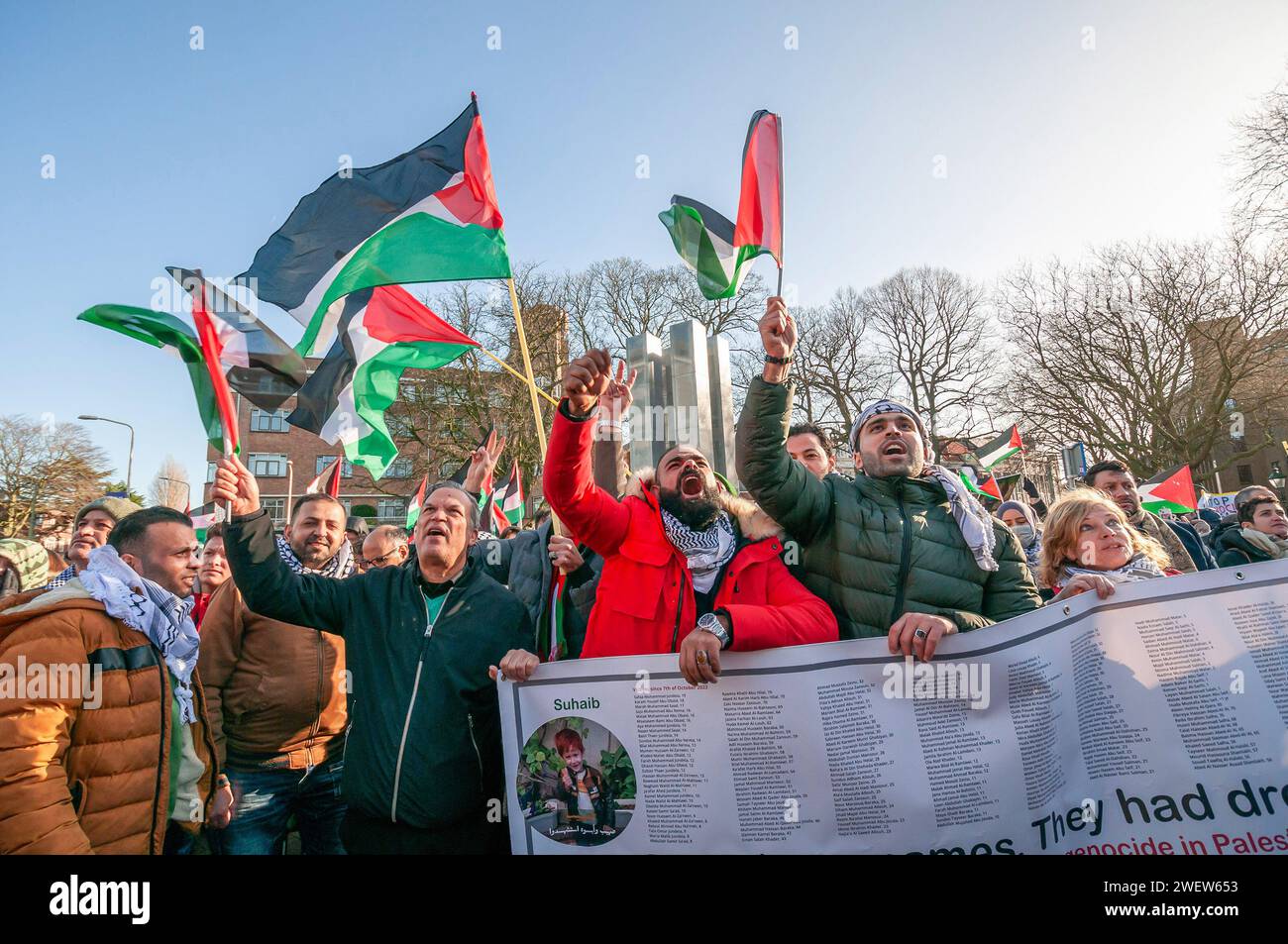 The Hague, Netherlands. 26th Jan, 2024. Palestinians with flags, banners, and placards, gather to watch the live transmission of today's International Court of Justice (ICJ) first ruling on Israel's Gaza war. The ICJ in The Hague ordered Israel on Friday to refrain from any acts of genocide against Palestinians in Gaza during its conflict with Hamas and to preserve evidence related to allegations of genocide. Credit: SOPA Images Limited/Alamy Live News Stock Photo