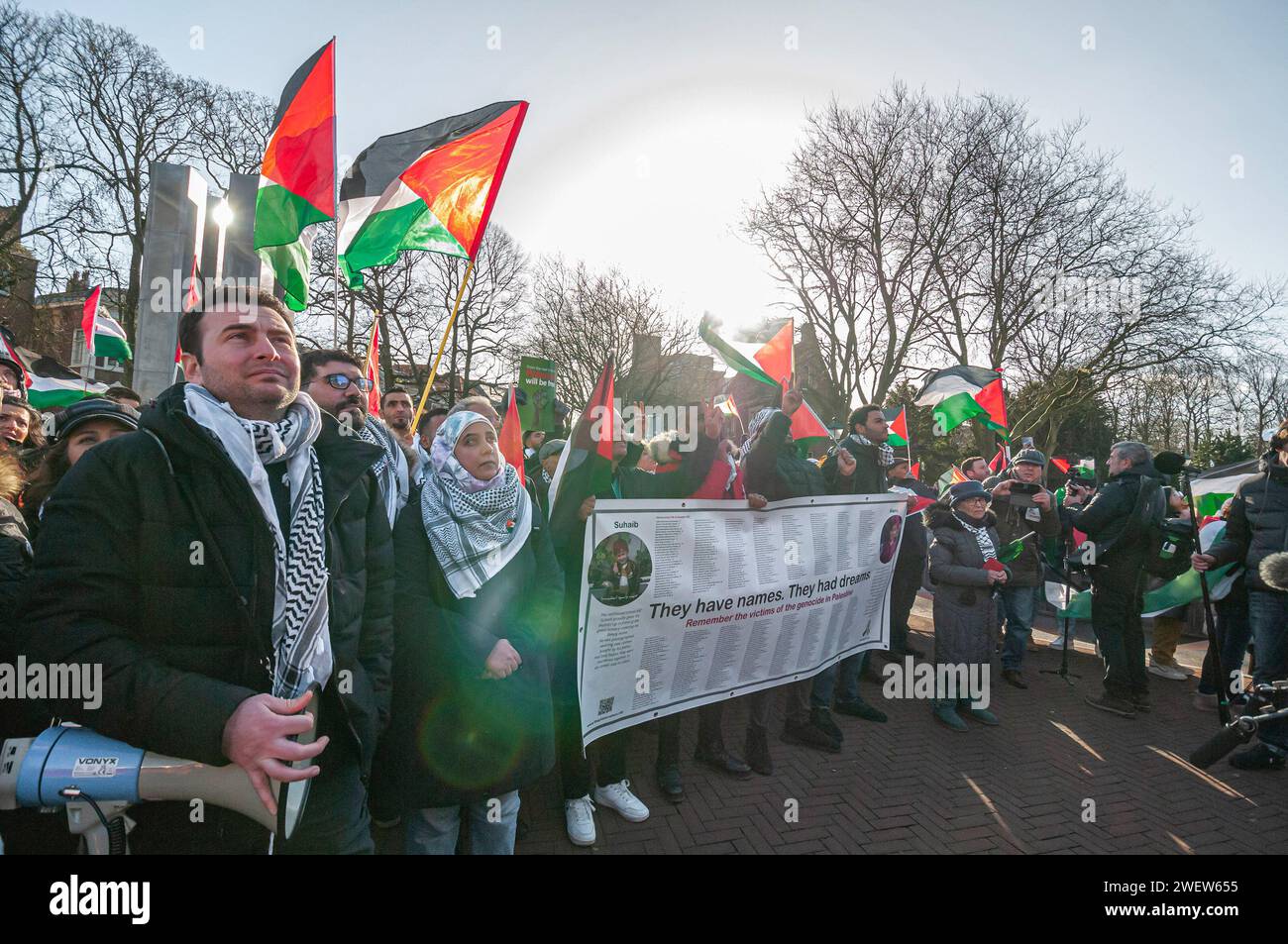 The Hague, Netherlands. 26th Jan, 2024. Palestinians with flags, banners, and placards, gather to watch the live transmission of today's International Court of Justice (ICJ) first ruling on Israel's Gaza war. The ICJ in The Hague ordered Israel on Friday to refrain from any acts of genocide against Palestinians in Gaza during its conflict with Hamas and to preserve evidence related to allegations of genocide. Credit: SOPA Images Limited/Alamy Live News Stock Photo