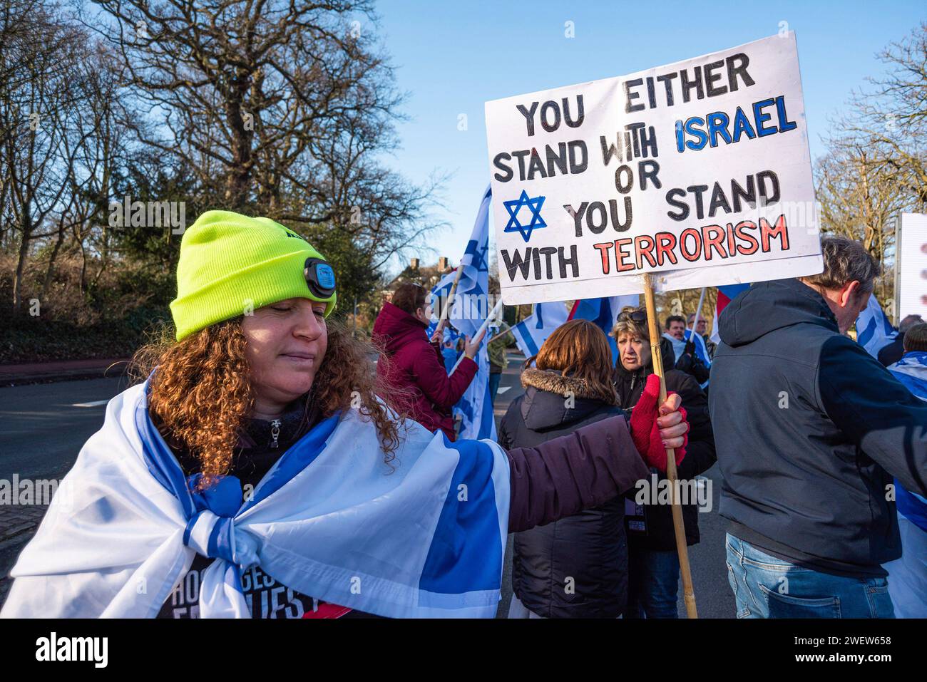 The Hague, Netherlands. 26th Feb, 2014. Israeli woman supporter with banner expressing her opinion, during today's International Court of Justice (ICJ) First ruling on Israelís Gaza war. The ICJ in The Hague ordered Israel on Friday to refrain from any acts of genocide against Palestinians in Gaza during its conflict with Hamas and to preserve evidence related to allegations of genocide. Credit: SOPA Images Limited/Alamy Live News Stock Photo
