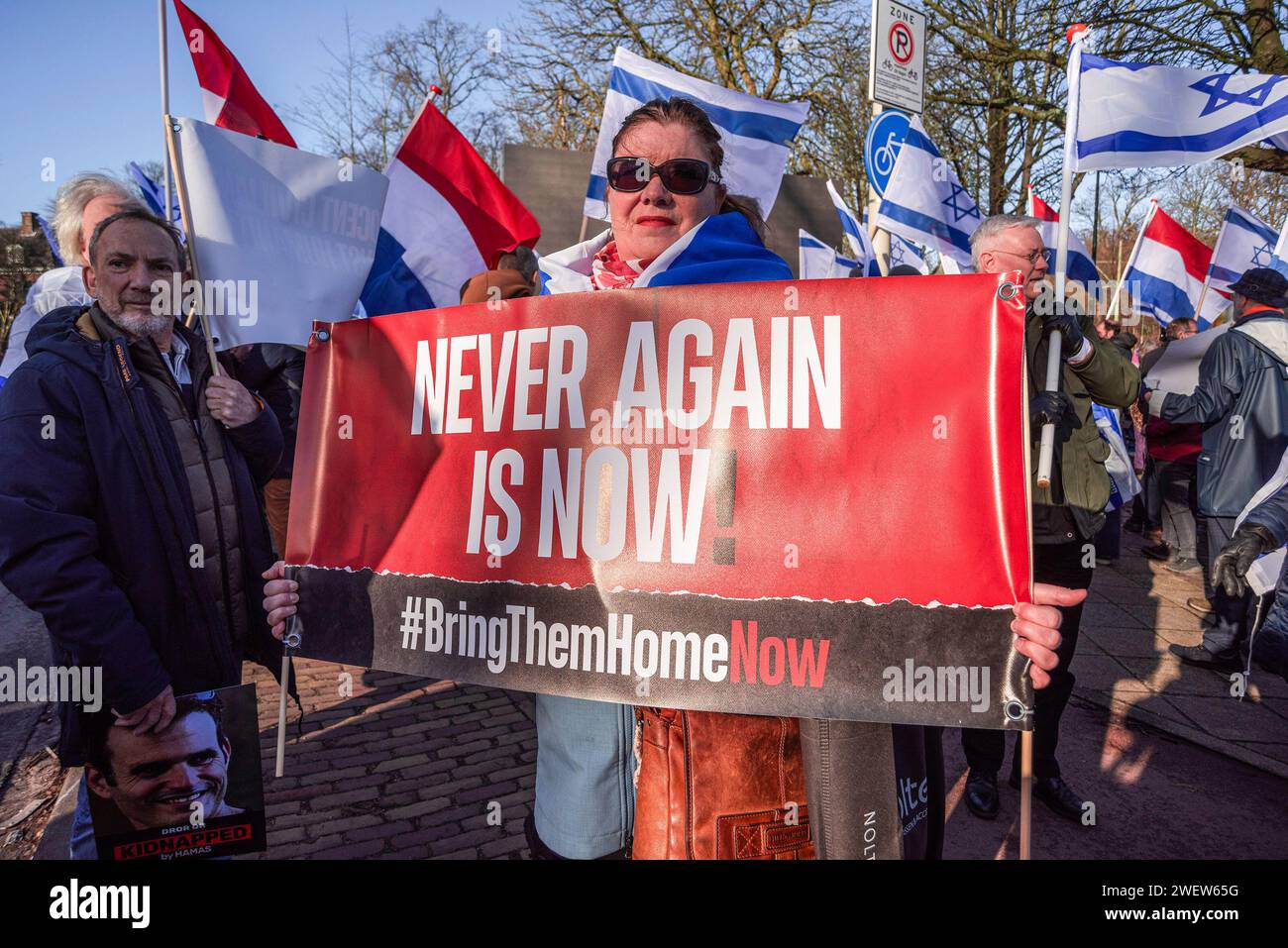 The Hague, Netherlands. 26th Feb, 2014. Israeli woman supporter with banner expressing her opinion, during today's International Court of Justice (ICJ) First ruling on Israel's Gaza war. The ICJ in The Hague ordered Israel on Friday to refrain from any acts of genocide against Palestinians in Gaza during its conflict with Hamas and to preserve evidence related to allegations of genocide. Credit: SOPA Images Limited/Alamy Live News Stock Photo