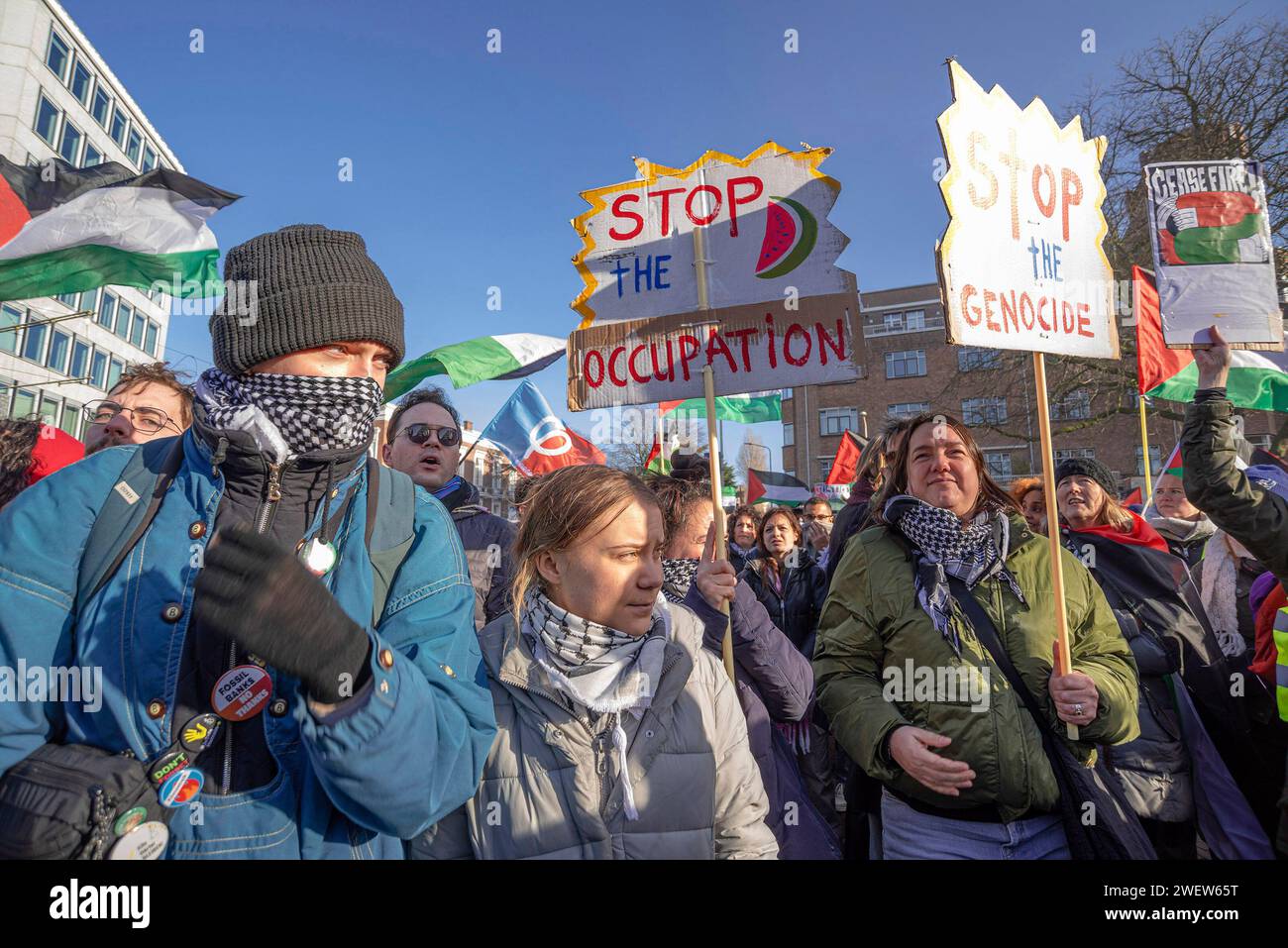 The Hague, Netherlands. 26th Feb, 2014. Young climate activist Greta Thunberg in the center, attends the Pro-Palestinian protest surrounded by placards during today's International Court of Justice (ICJ) First ruling on Israel's Gaza war. The ICJ in The Hague ordered Israel on Friday to refrain from any acts of genocide against Palestinians in Gaza during its conflict with Hamas and to preserve evidence related to allegations of genocide. Credit: SOPA Images Limited/Alamy Live News Stock Photo