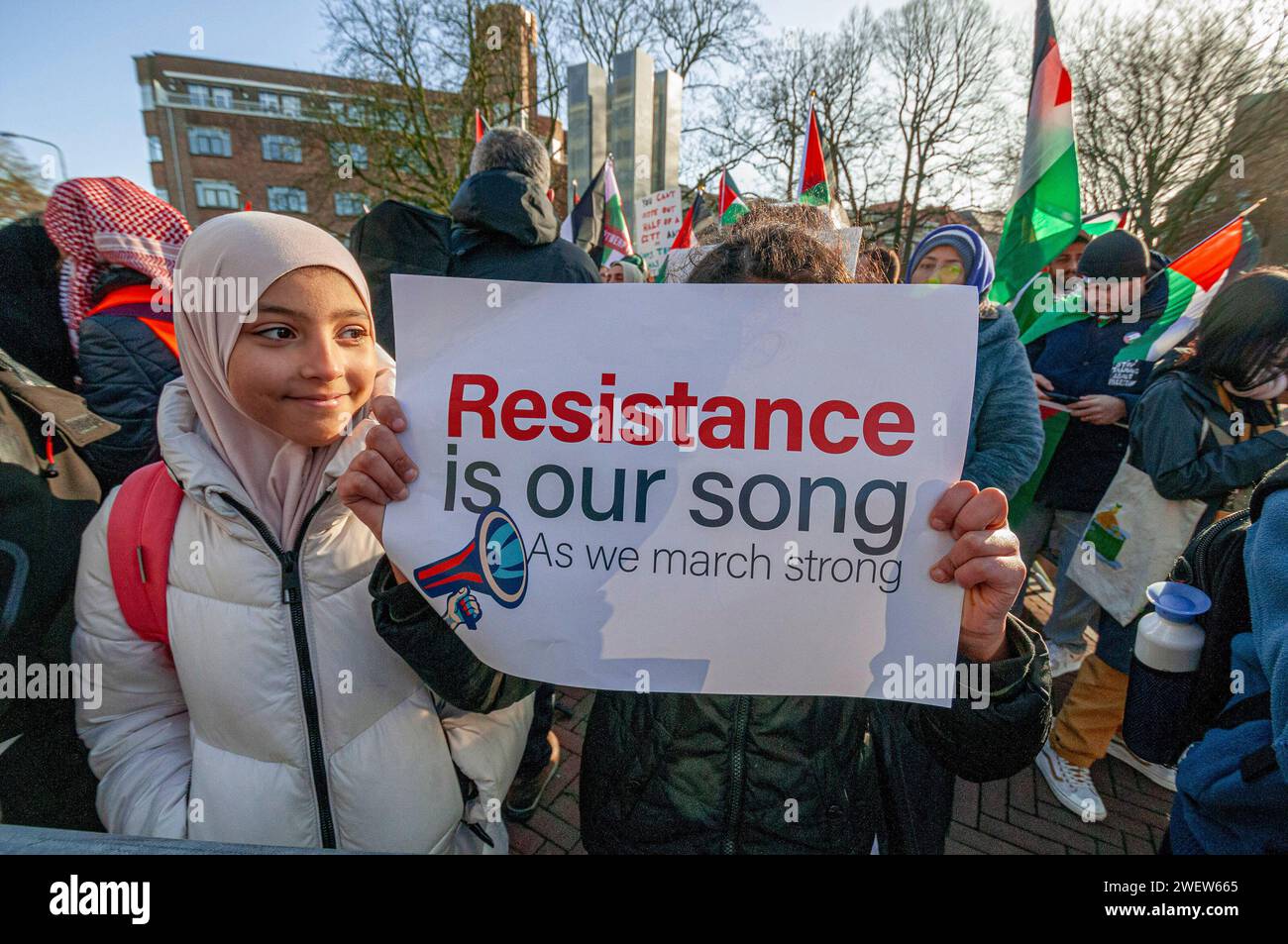 The Hague, Netherlands. 26th Jan, 2024. Two young Palestinian supporters with placards express their opinion, during today's International Court of Justice (ICJ) First ruling on Israel's Gaza war. The ICJ in The Hague ordered Israel on Friday to refrain from any acts of genocide against Palestinians in Gaza during its conflict with Hamas and to preserve evidence related to allegations of genocide. Credit: SOPA Images Limited/Alamy Live News Stock Photo