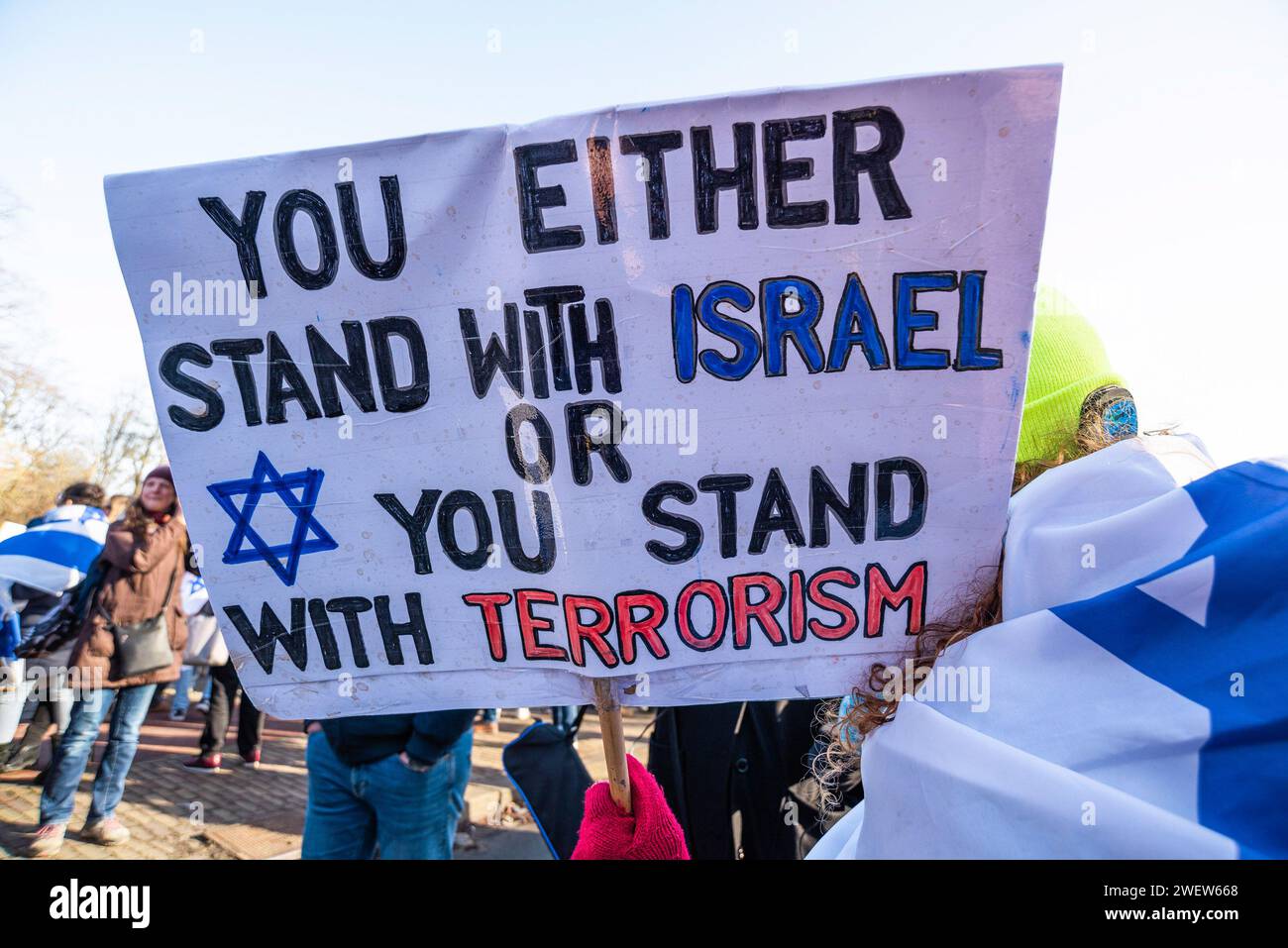 The Hague, Netherlands. 26th Feb, 2014. Israeli woman supporter with banner expressing her opinion, during today's International Court of Justice (ICJ) First ruling on Israelís Gaza war. The ICJ in The Hague ordered Israel on Friday to refrain from any acts of genocide against Palestinians in Gaza during its conflict with Hamas and to preserve evidence related to allegations of genocide. Credit: SOPA Images Limited/Alamy Live News Stock Photo
