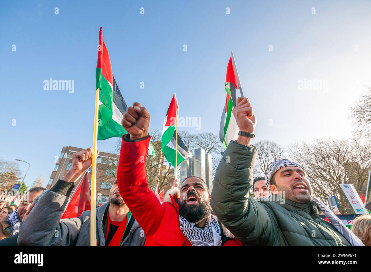 The Hague, Netherlands. 26th Jan, 2024. Palestinians with flags seen chant slogans during a live transmission, during today's International Court of Justice (ICJ) First ruling on Israel's Gaza war. The ICJ in The Hague ordered Israel on Friday to refrain from any acts of genocide against Palestinians in Gaza during its conflict with Hamas and to preserve evidence related to allegations of genocide. Credit: SOPA Images Limited/Alamy Live News Stock Photo