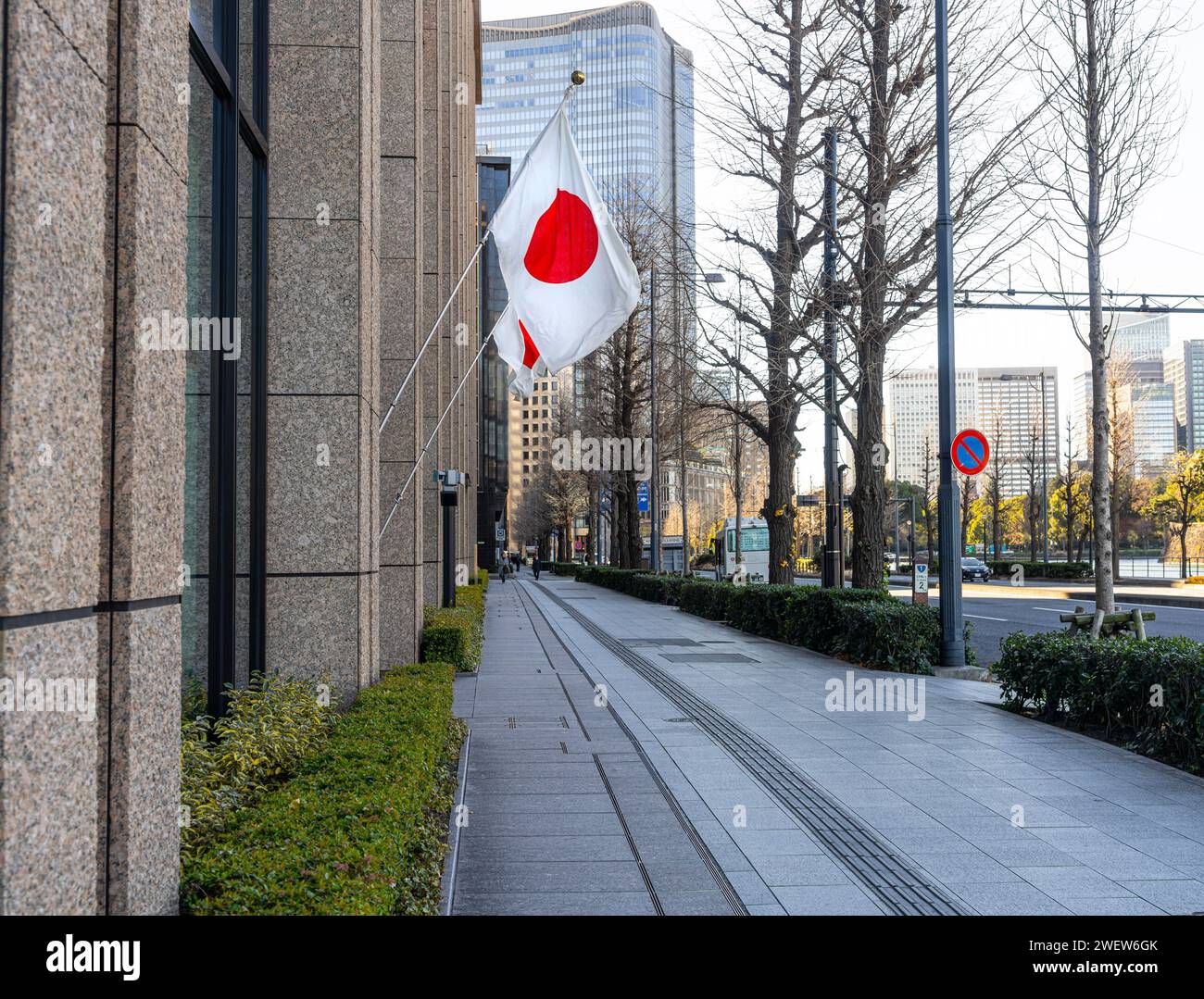 Tokyo, Japan. January 8, 2024. the Japanese flag displayed outside a building in the city center Stock Photo
