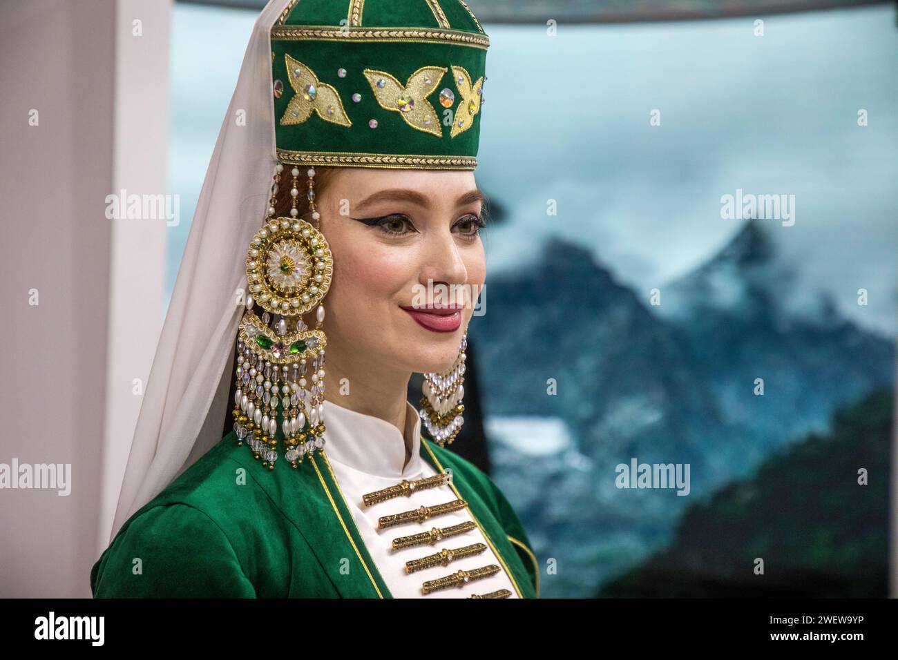 Moscow, Russia. 21st of January, 2024. A girl in a national costume at the stand of the Karachay-Cherkess Republic at the exhibition-forum 'Russia' at VDNH in Moscow, Russia Stock Photo