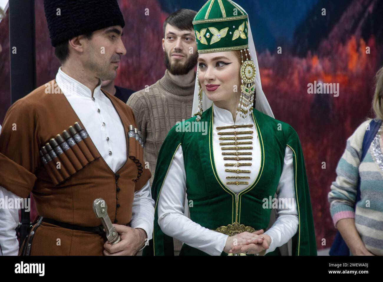 Moscow, Russia. 21st of January, 2024. A man and a woman in traditional national costumes dance a Caucasian dance at the stand of the Karachay-Cherkess Republic at the exhibition-forum 'Russia' at VDNH in Moscow, Russia Stock Photo